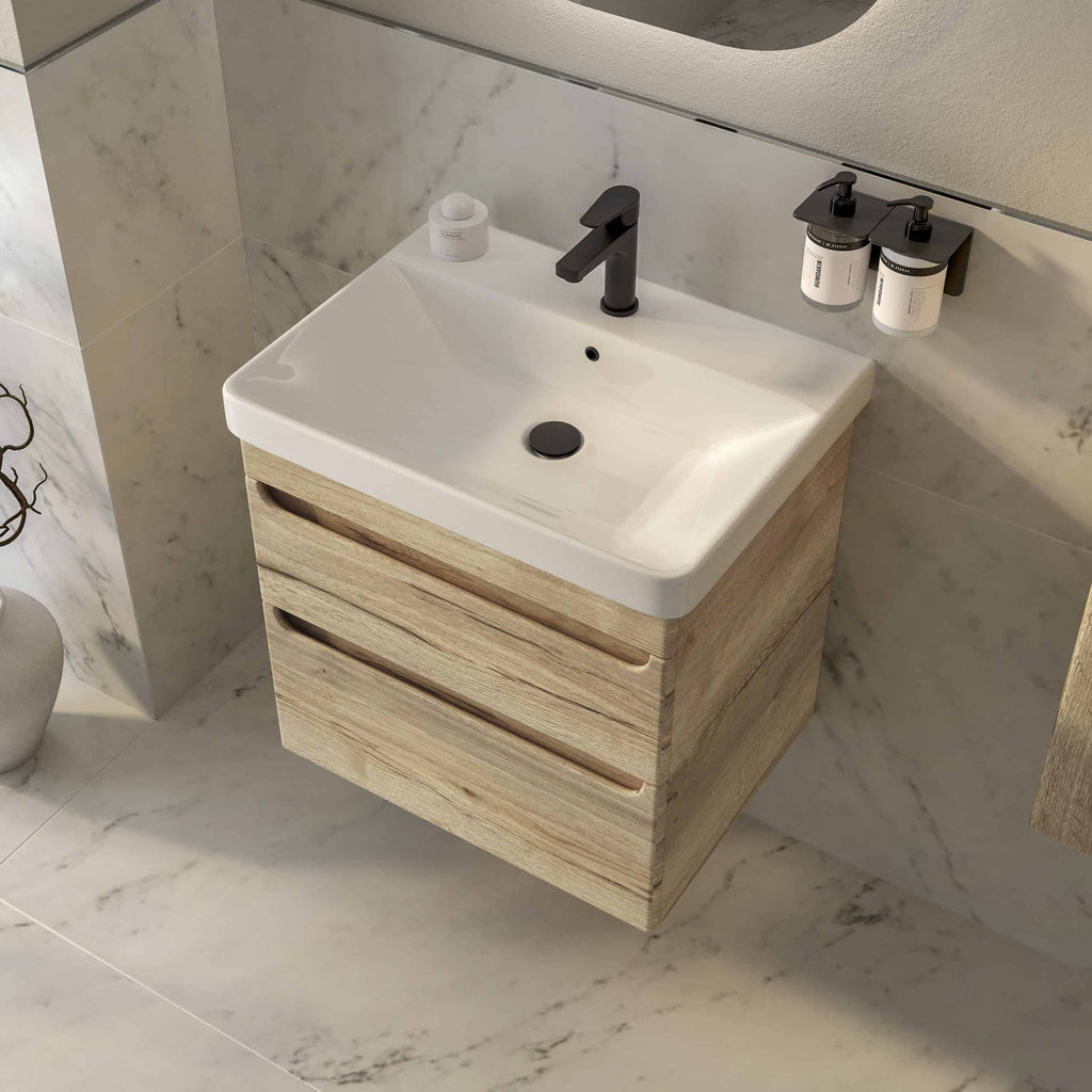 Modern bathroom vanity with a sleek white ceramic sink, black matte faucet, and wooden drawer cabinet, featuring contemporary style and practical storage solutions.