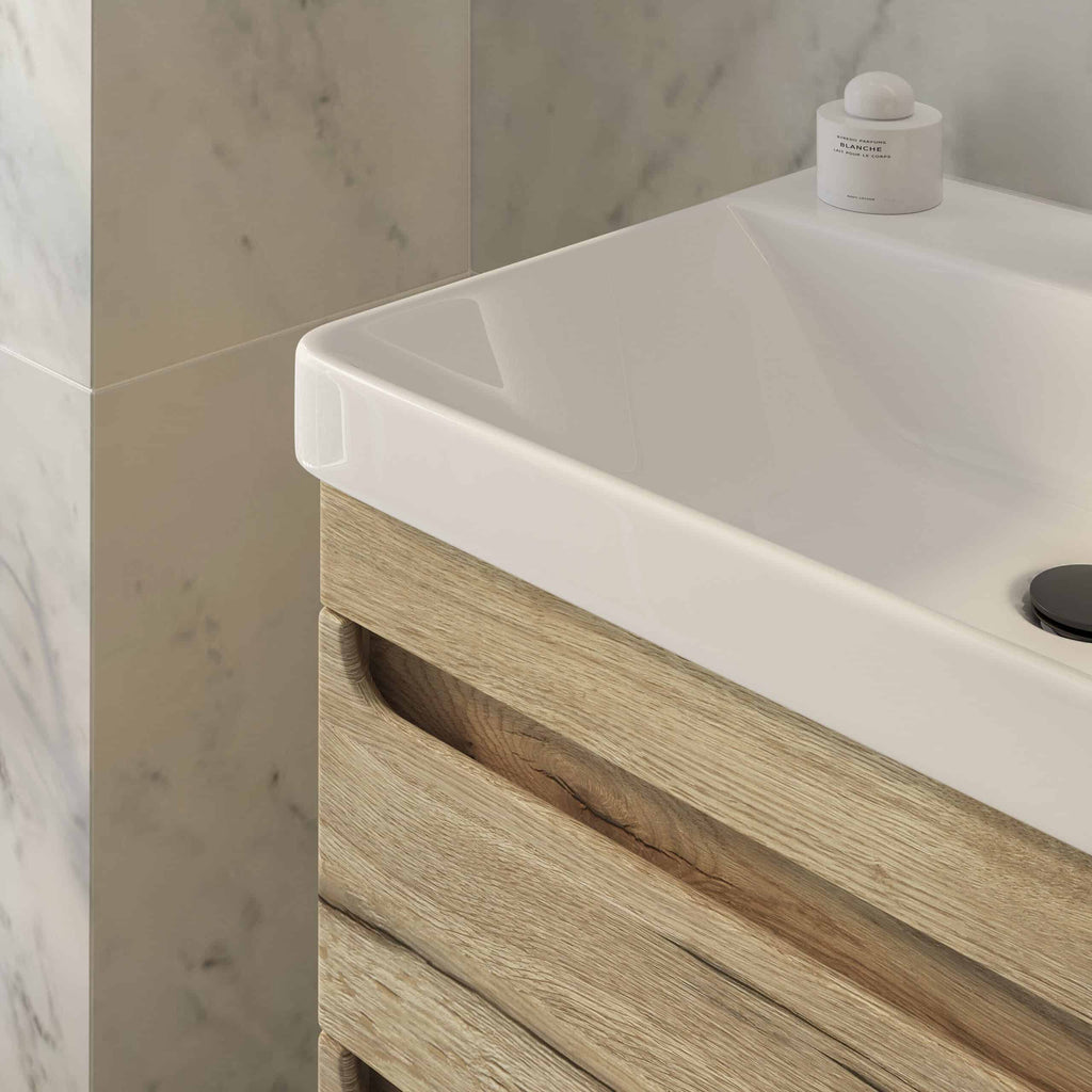 Elegant bathroom vanity with a white ceramic sink and natural wood finish, perfect for modern bathroom designs; showcases high-quality fixtures and stylish decor.