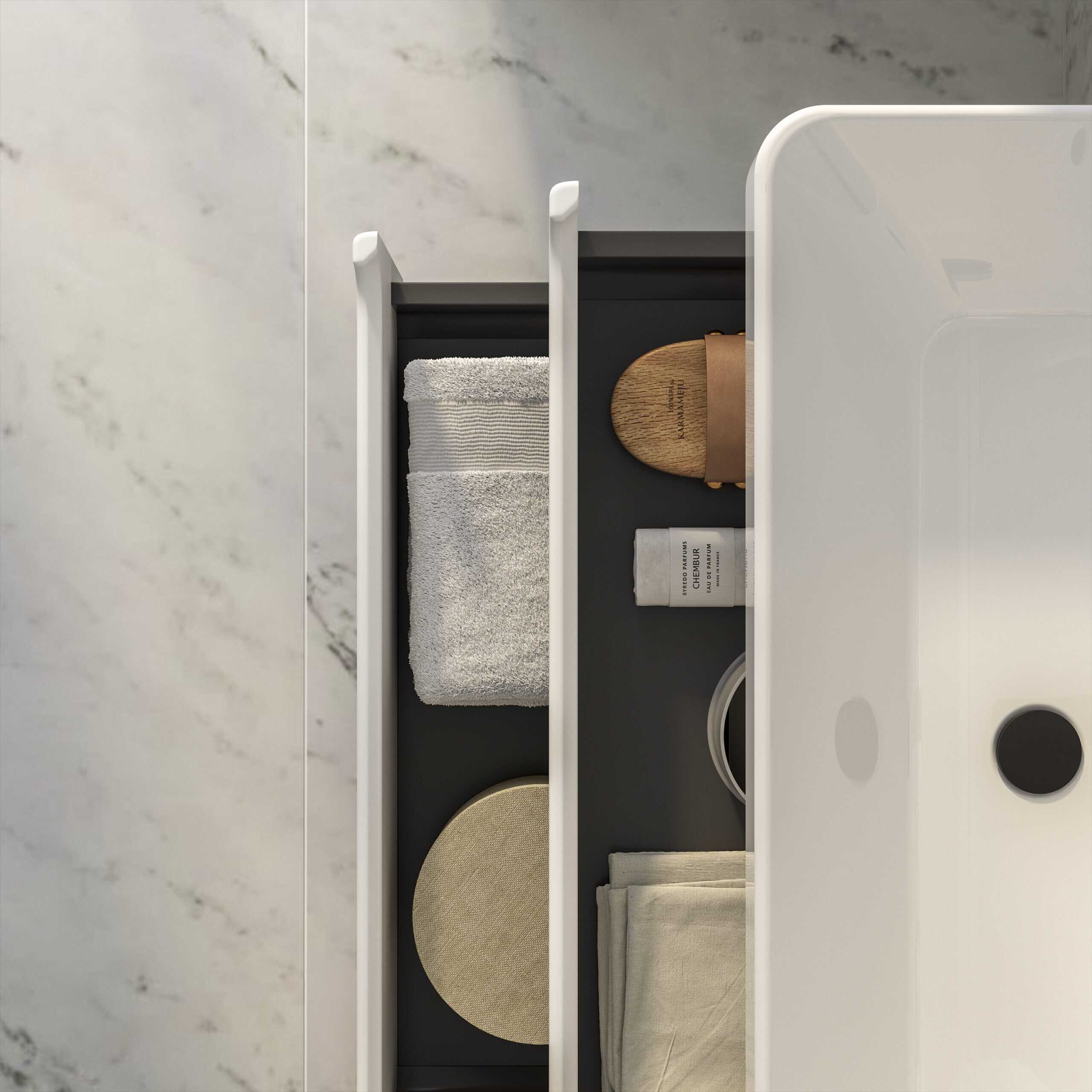Stylish bathroom organiser drawer with neatly folded towels, wooden accessories, and toiletries, showcasing modern bathroom storage solutions for a sleek, clutter-free space.