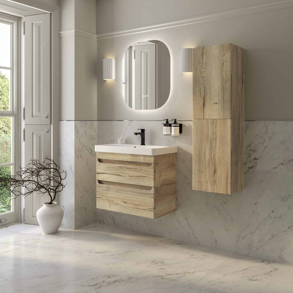 Natural wood bathroom vanity and cabinet set with modern black fixtures, set against a marble tiled wall with stylish lighting and a large mirror, perfect for contemporary bathrooms.