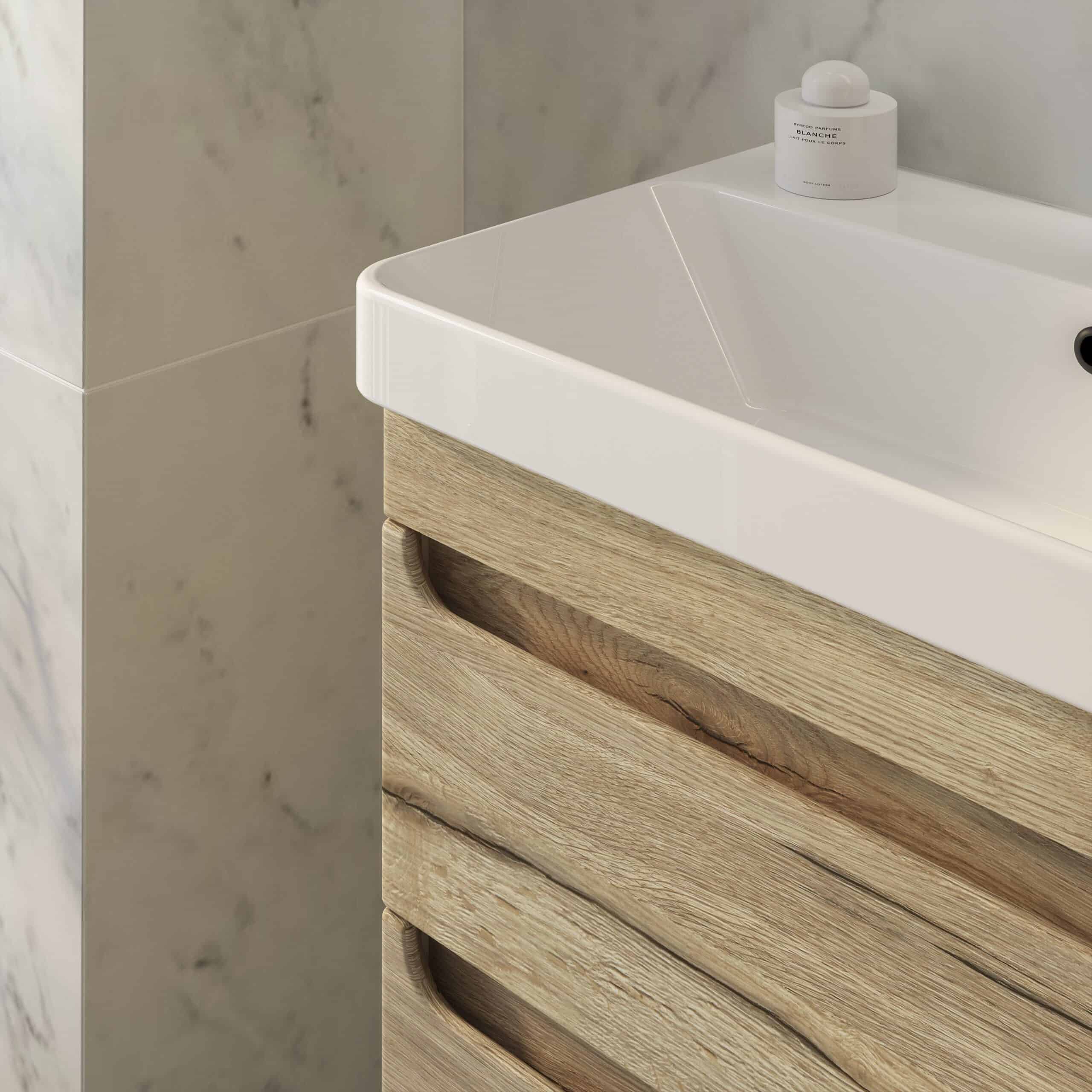 Contemporary bathroom vanity unit with a sleek white ceramic sink and natural wood finish drawers, set against a marble wall for a modern, stylish look.