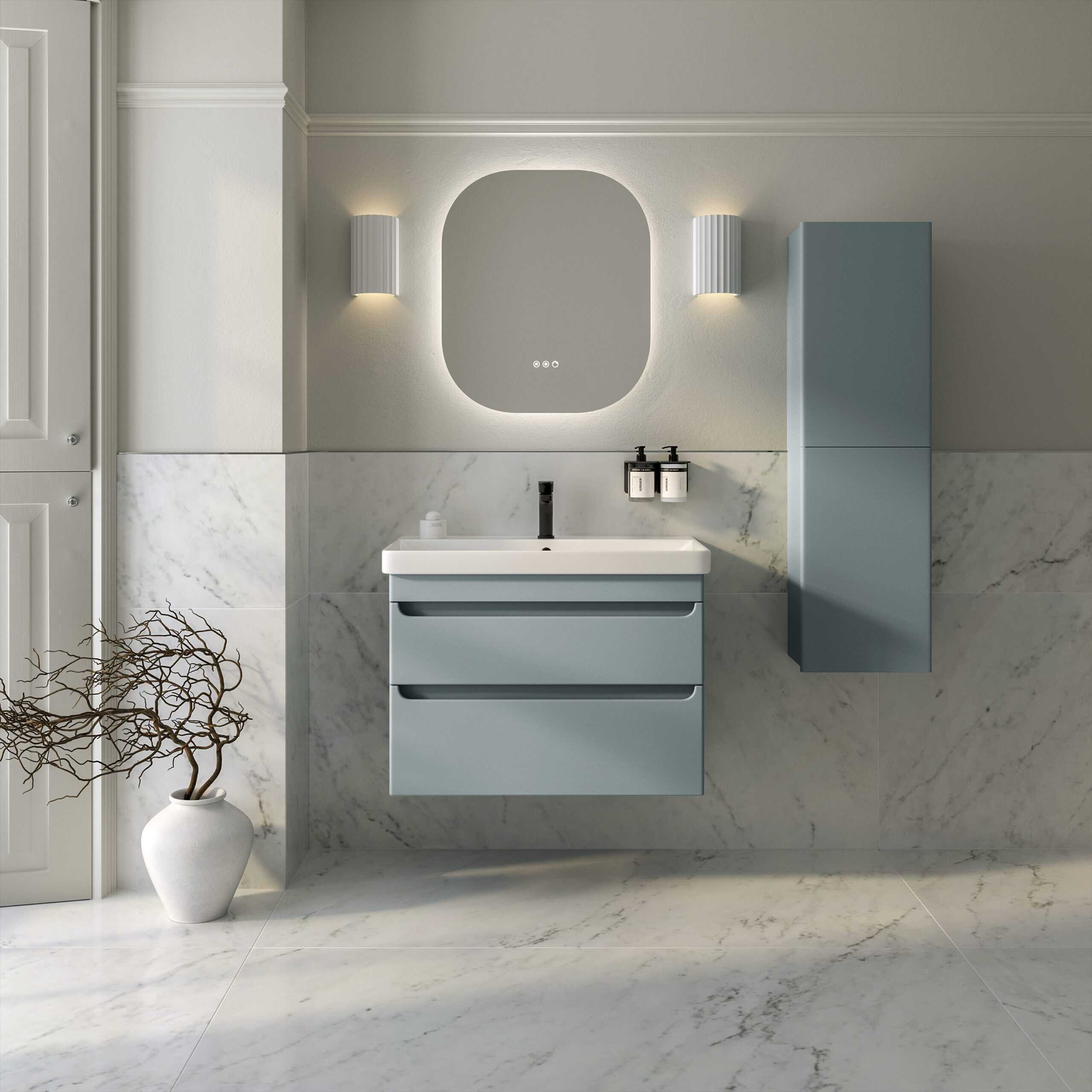 Modern minimalist bathroom with light blue vanity unit and matching wall cabinet, marble tiled walls and floors, illuminated mirror, and sleek black fixtures, creating a clean and contemporary bathroom design.