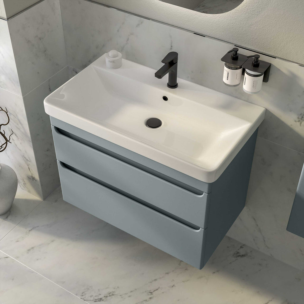 Sleek modern bathroom vanity with integrated sink featuring black fixtures and grey drawers, designed for contemporary Bubly bathrooms in UK homes.