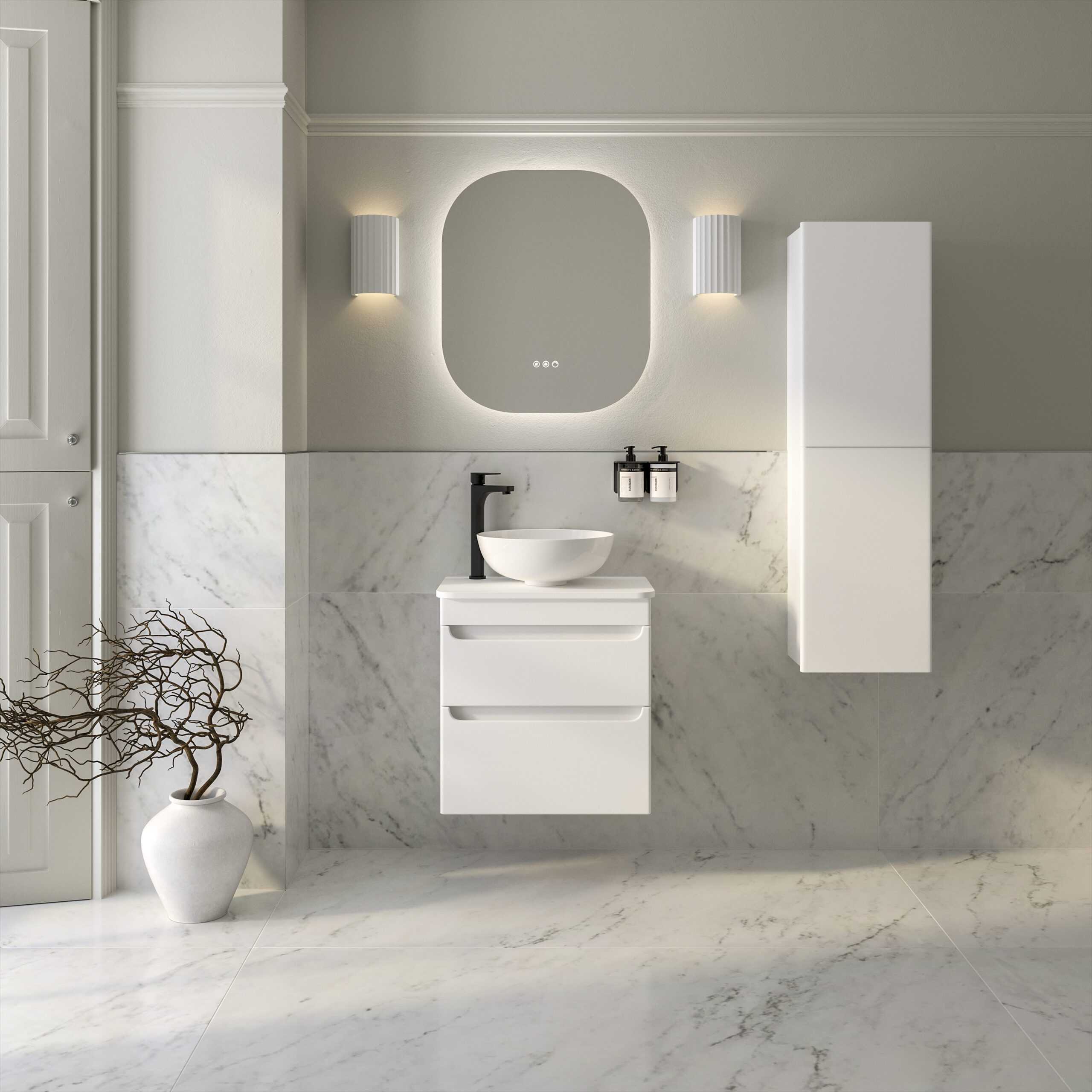 Modern minimalistic bathroom vanity with white wall-mounted cabinet and vessel sink, black faucet, and stylish oval mirror, featuring sleek design and marble tiles, ideal for contemporary Bubly Bathrooms.