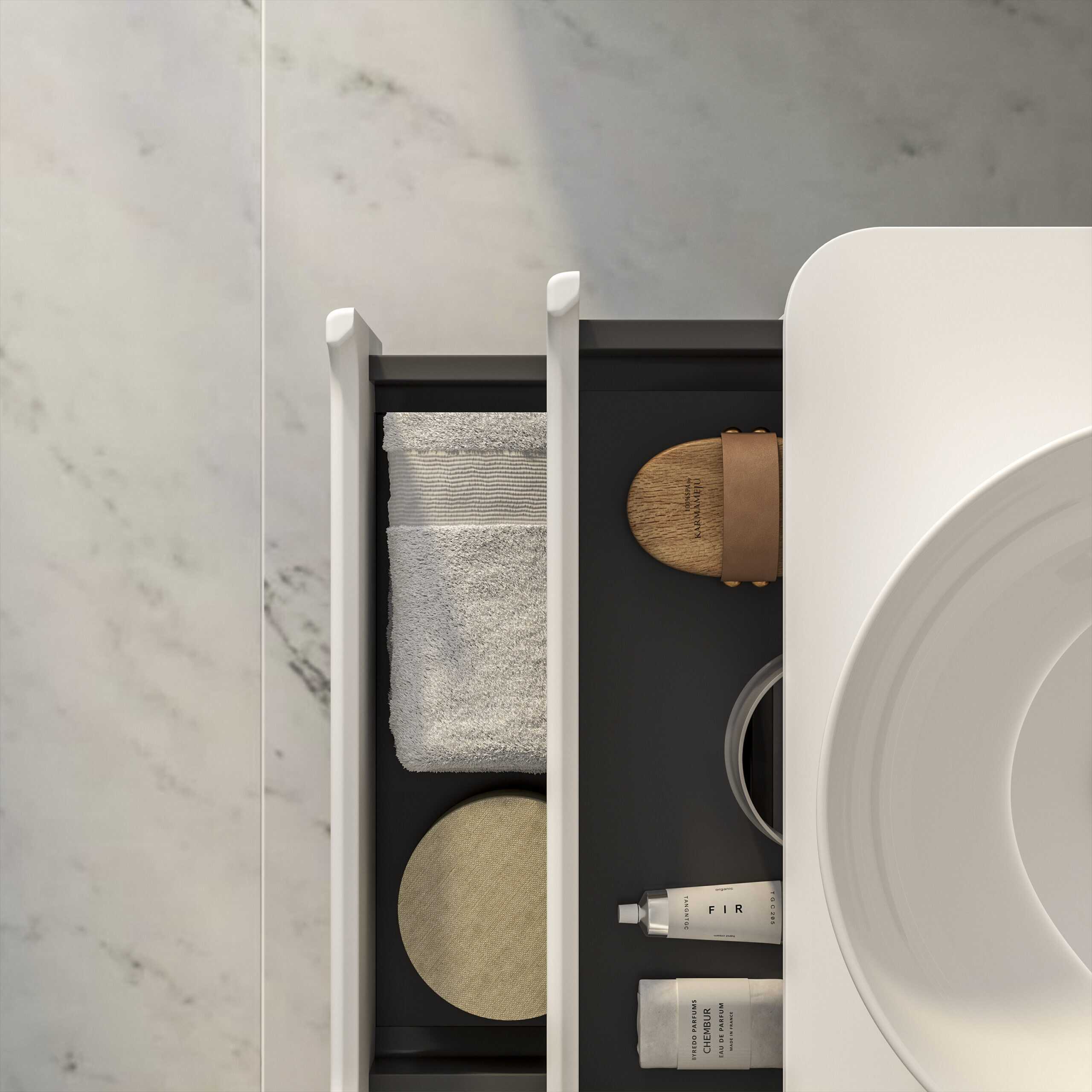 Minimalist bathroom storage drawer with neatly arranged towels, skincare products, and accessories, showcasing modern bathroom organisation and design.