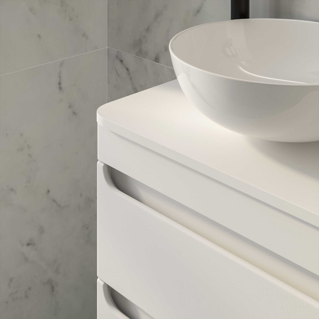 Sleek white bathroom vanity with a modern ceramic basin, minimalist design, perfect for contemporary bathrooms and stylish bathroom furniture.