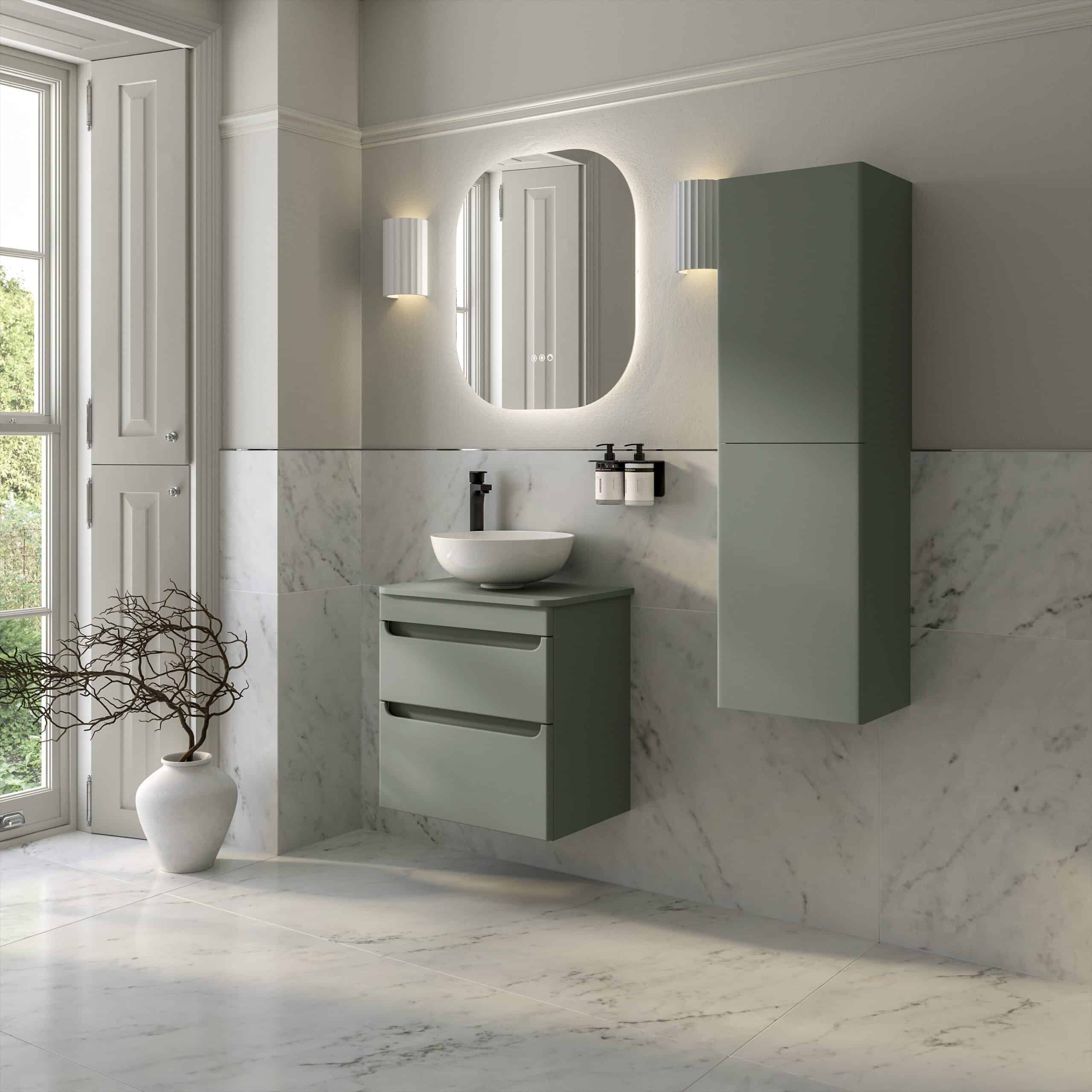 Sleek modern bathroom with a floating green vanity, wall-mounted mirror, and marble walls, creating a luxurious and contemporary bathroom design.