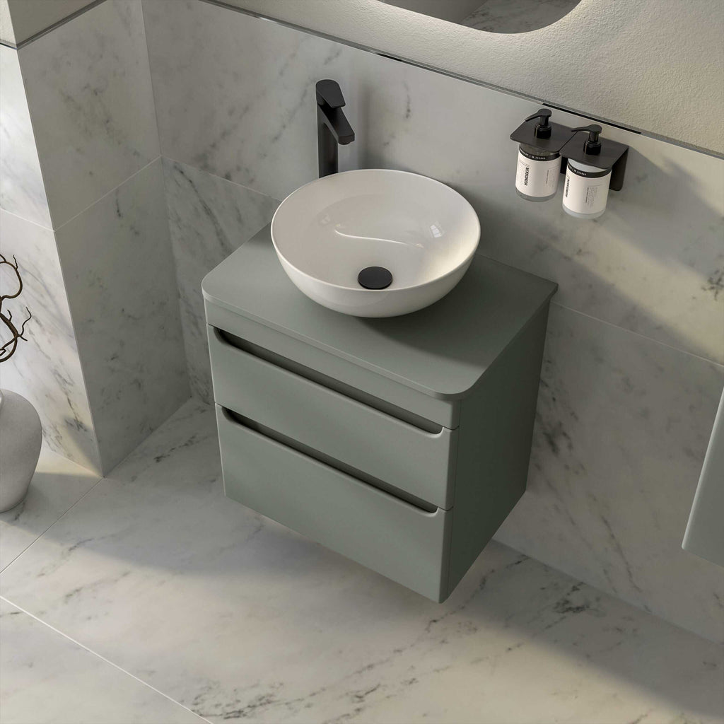 Contemporary bathroom vanity with vessel sink and matte black faucet, featuring sleek drawers for modern bathroom storage and minimalist design.