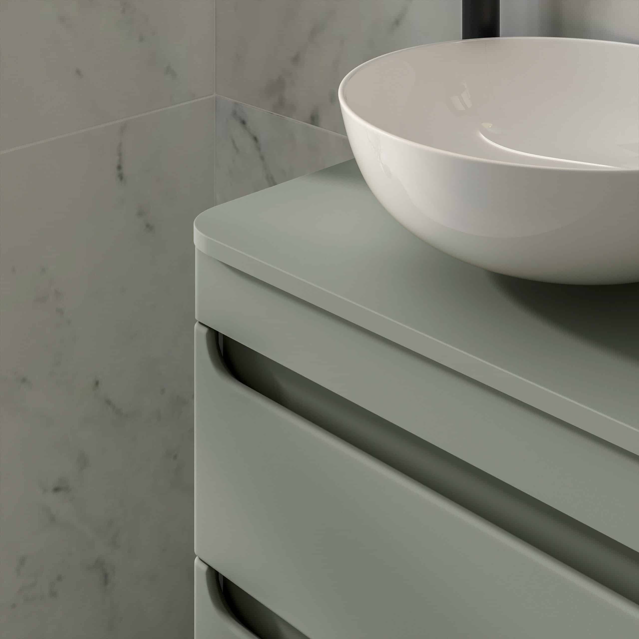 Sleek modern bathroom vanity with a round white vessel sink, smooth matte finish, and marble tiled wall background perfect for contemporary bathroom design.