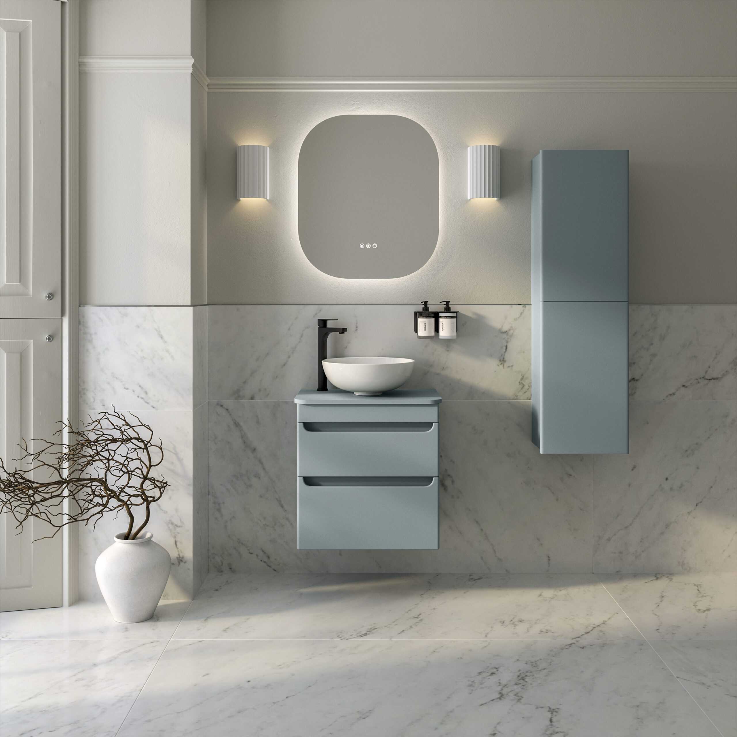 Modern minimalist bathroom with floating vanity, vessel sink, wall-mounted mirror with LED lighting, and sleek storage cabinet featuring contemporary design elements and neutral tones.