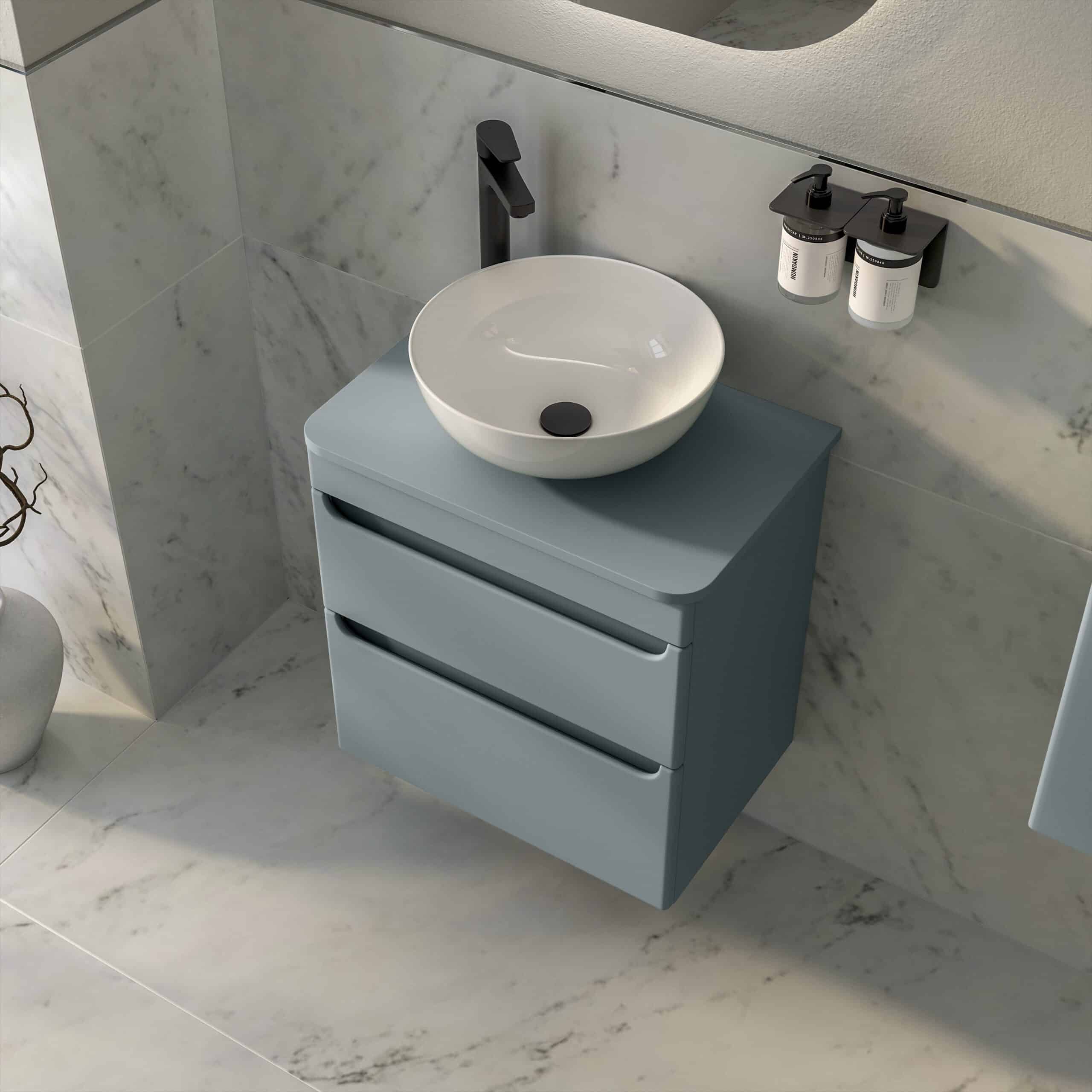 Contemporary bathroom vanity with a bowl sink, black faucet, and wall-mounted storage, set against a marble wall and floor. Perfect for modern bathroom design and organisation.
