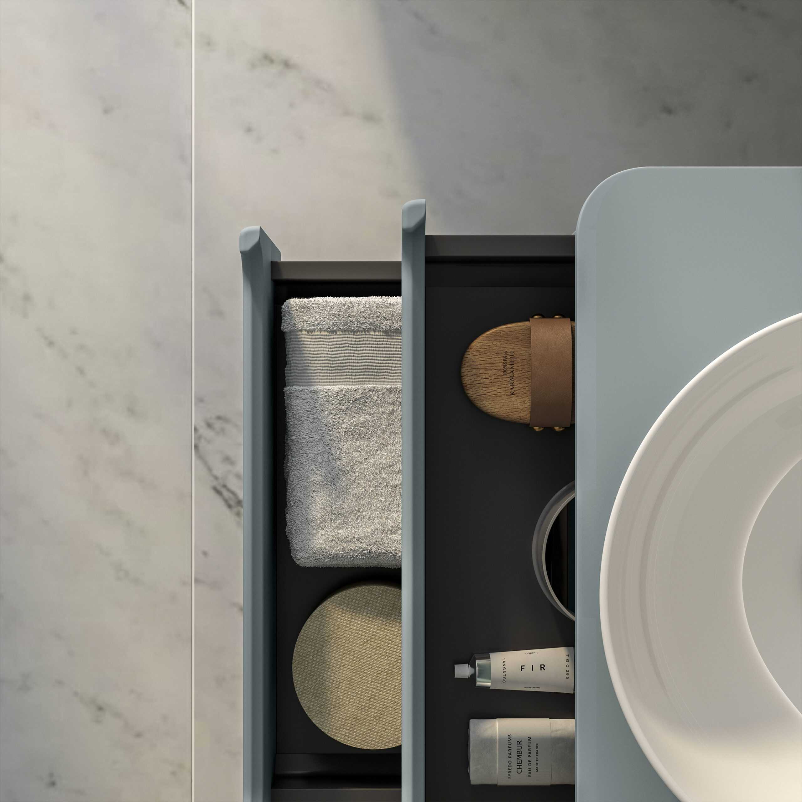 Luxurious bathroom storage drawer with neatly organised toiletries, hand towels, and grooming essentials in a modern bathroom setting. Perfect for sleek, minimalist bathroom designs.