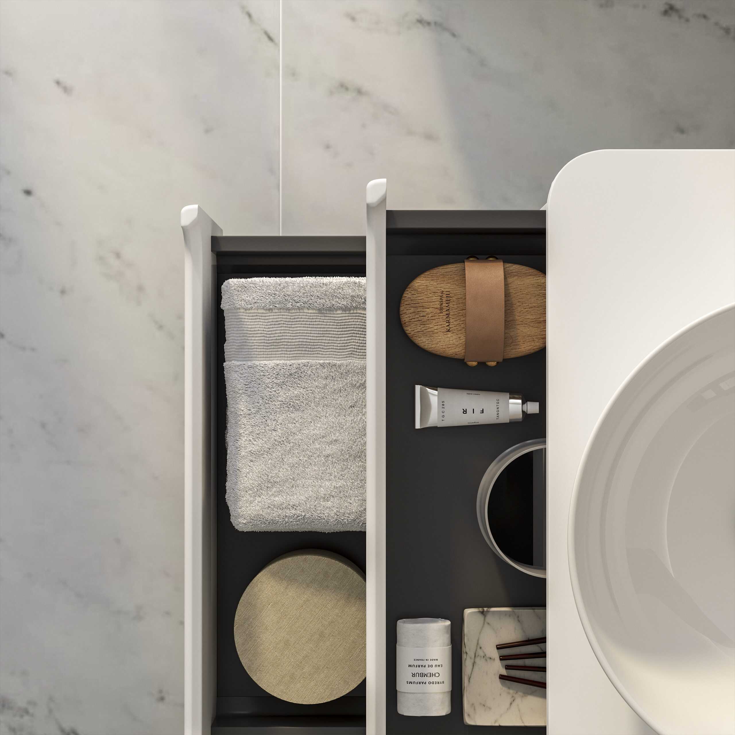 Neatly organised bathroom drawer with towels, skincare products, and accessories, showcasing modern bathroom storage solutions.