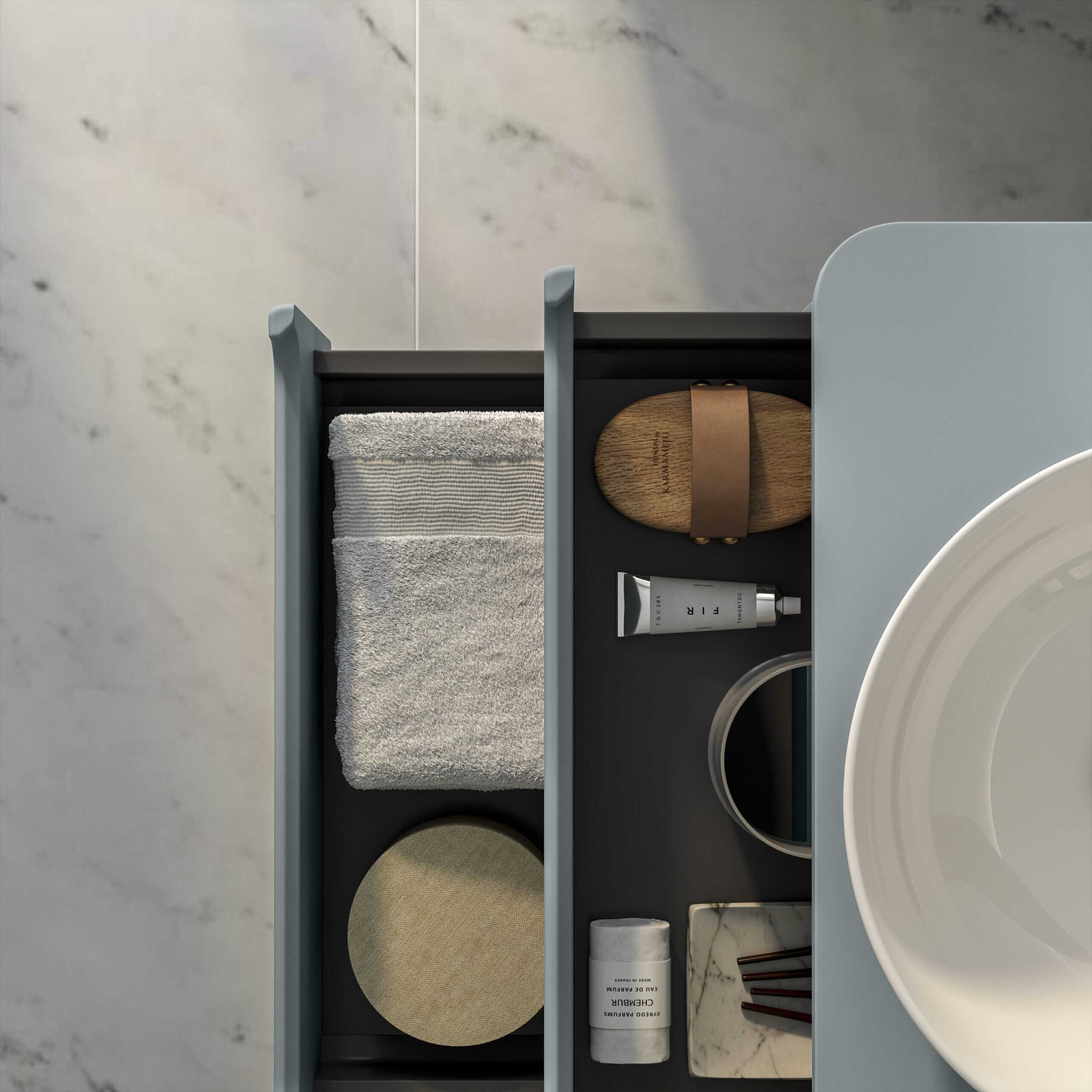 Minimalist bathroom storage drawer with neatly organised toiletries, towel, and accessories, showcasing modern bathroom organisation solutions.