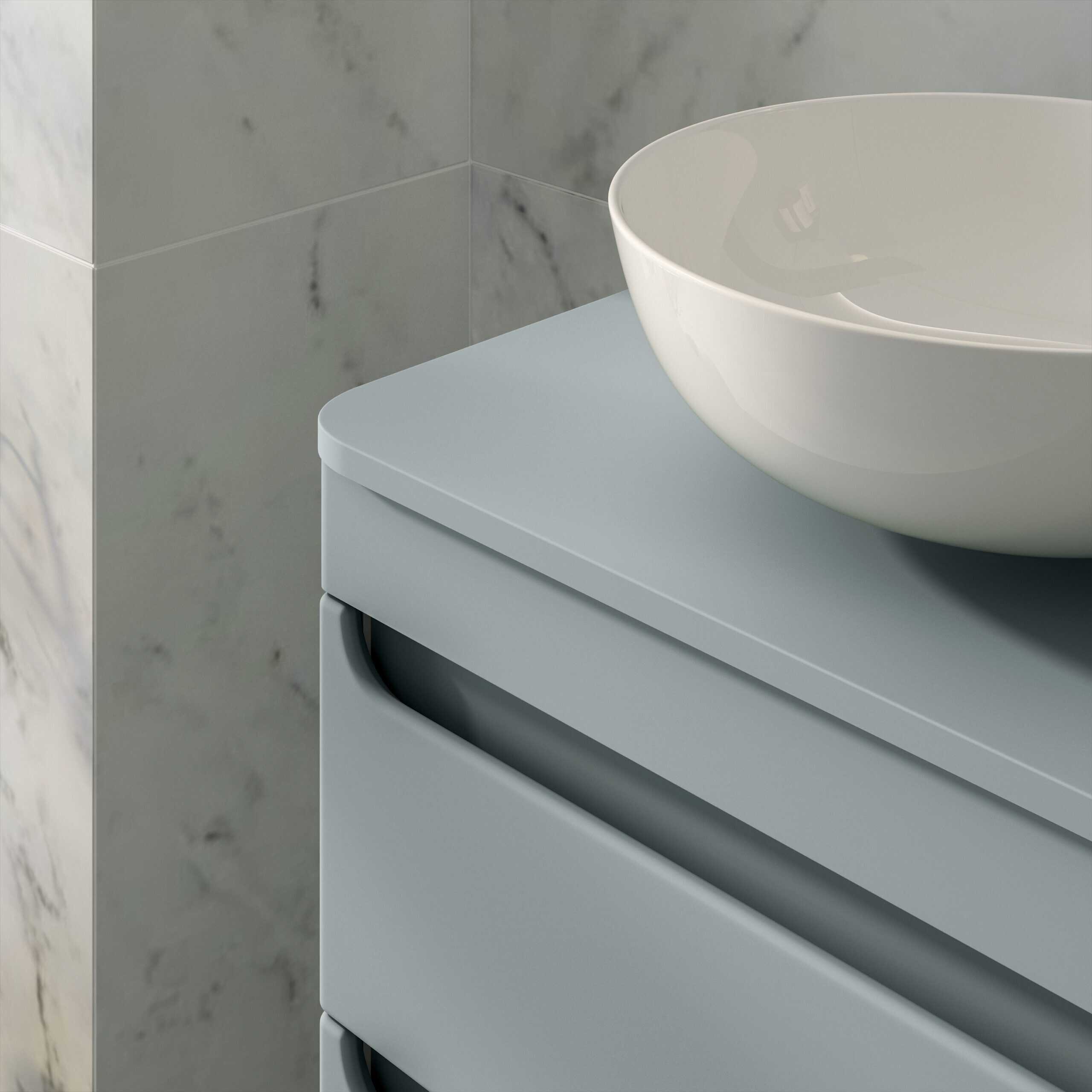 Sleek grey bathroom vanity with a modern white vessel sink and marble wall tiles, perfect for contemporary bathroom design and stylish bathroom furniture.