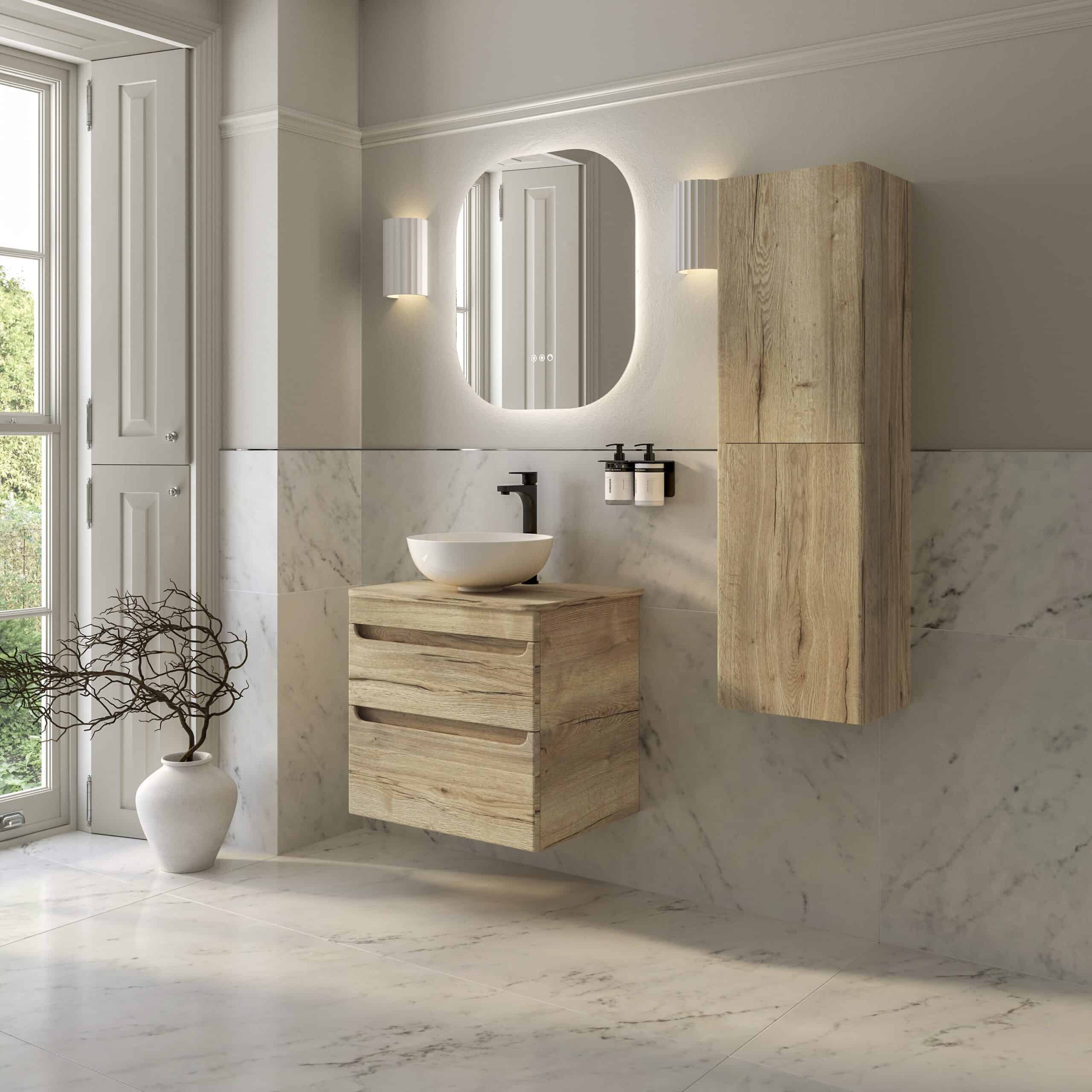 Sleek modern bathroom with natural wood vanity, wall-mounted cabinet, marble walls and floors, round vessel sink, and backlit mirror, creating a minimalist and elegant bathroom design.