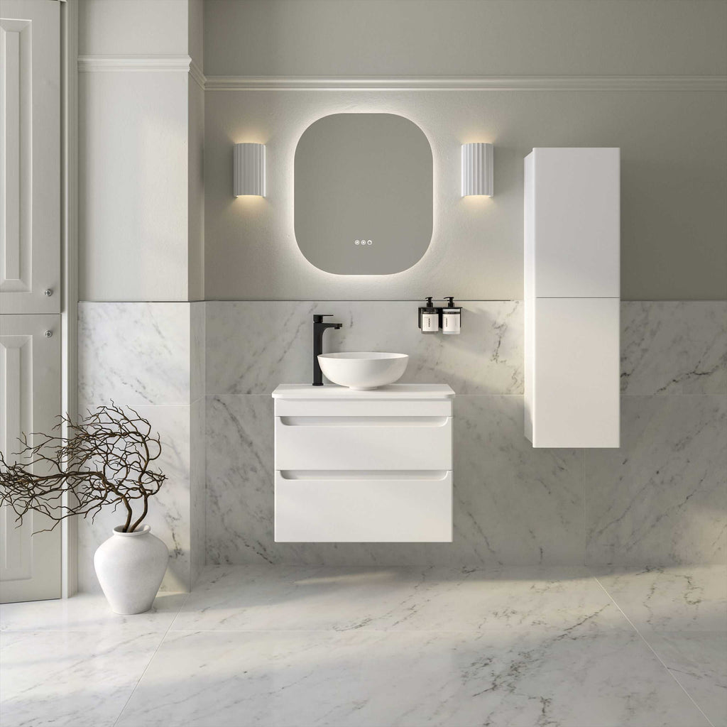 Modern minimalist bathroom vanity with white floating drawers, vessel sink, black fixtures, and large mirror, set against marble wall and floor for a luxurious bathroom decor.