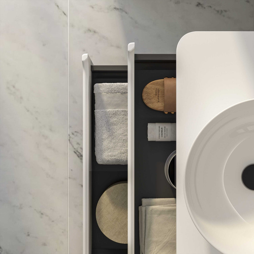 Luxurious modern bathroom storage with towels, skincare products, and accessories on a sleek black and white vanity unit. Elegant design perfect for contemporary bathroom interior.