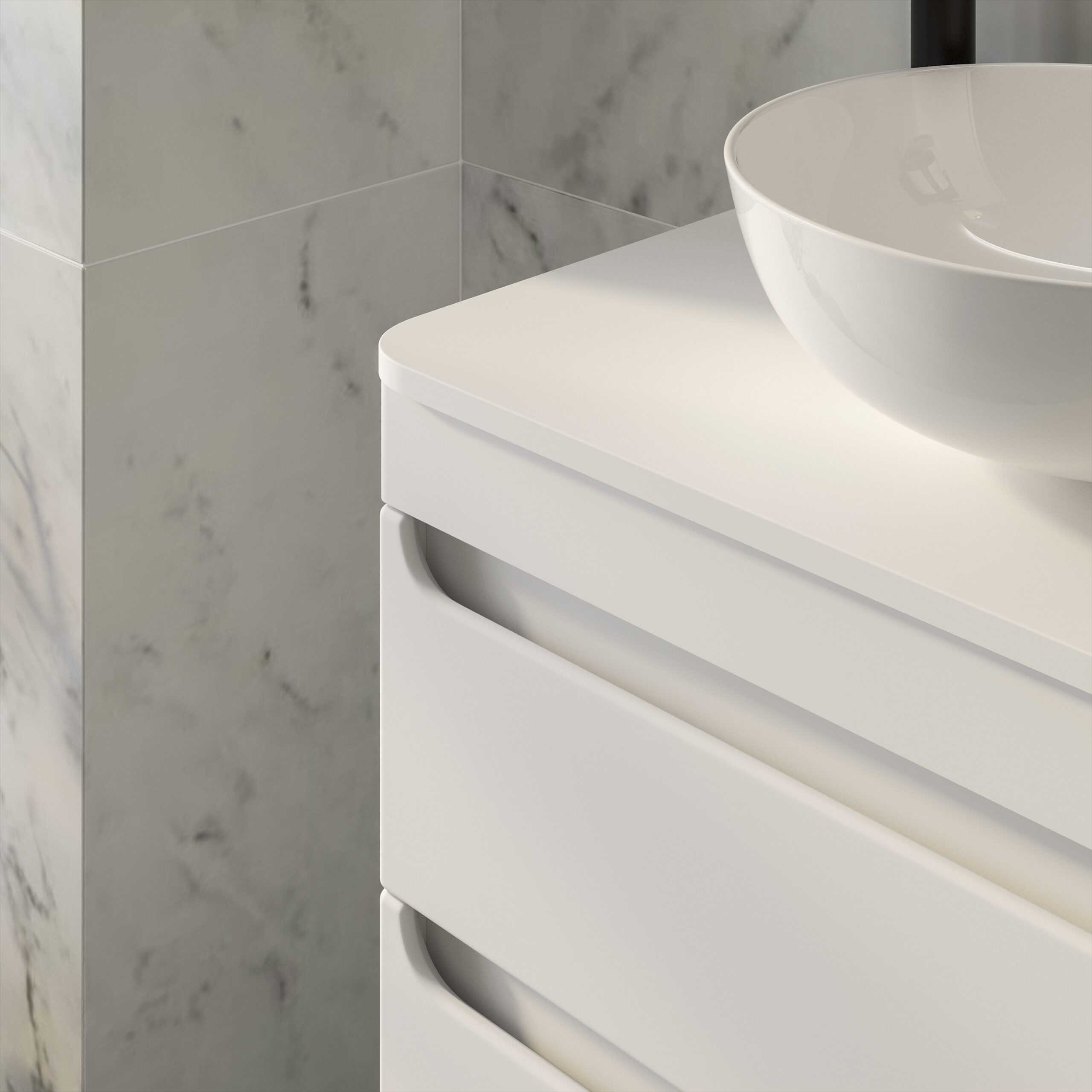 Sleek white bathroom vanity unit with integrated handle-less drawers and a modern ceramic basin for contemporary bathroom decor.