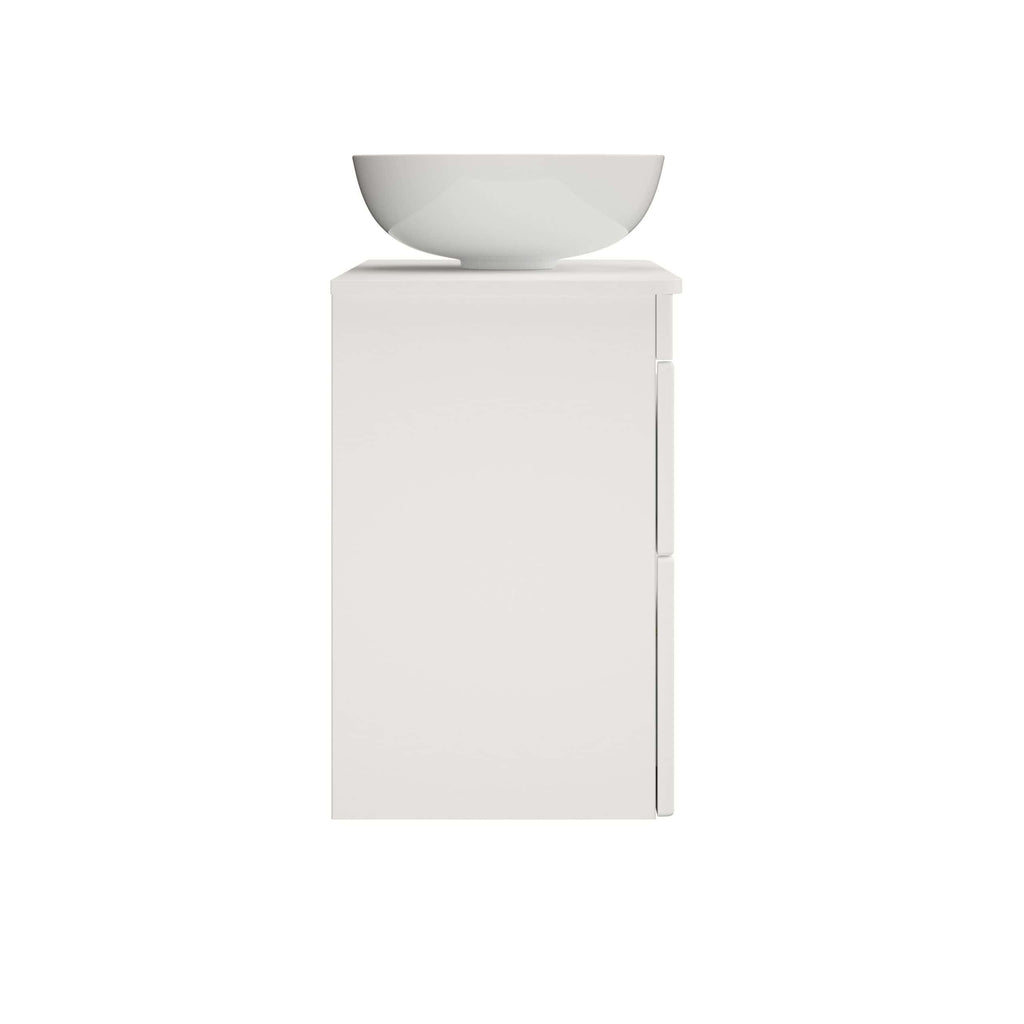 Minimalist white bathroom vanity with a modern ceramic basin for elegant bathroom décor and storage solutions.