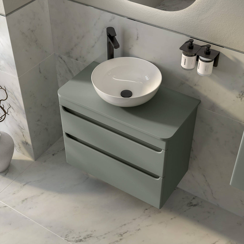 Sleek modern bathroom vanity with a round vessel sink, black fixtures, and minimalist storage drawers, ideal for contemporary bathroom design and organisation.