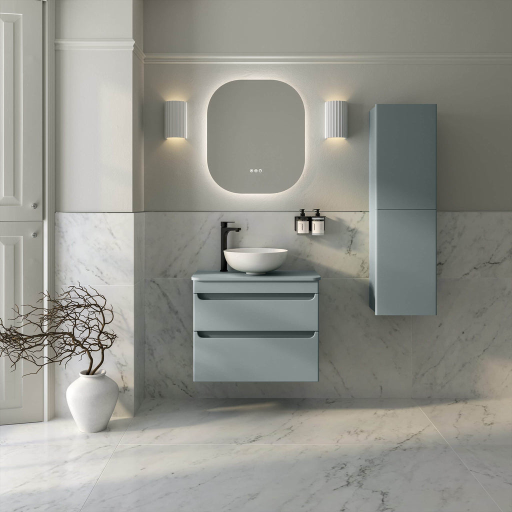 Minimalist grey bathroom vanity with a round vessel sink, modern black fixtures, and sleek wall-mounted storage, set against a marble wall and floor for a contemporary aesthetic.