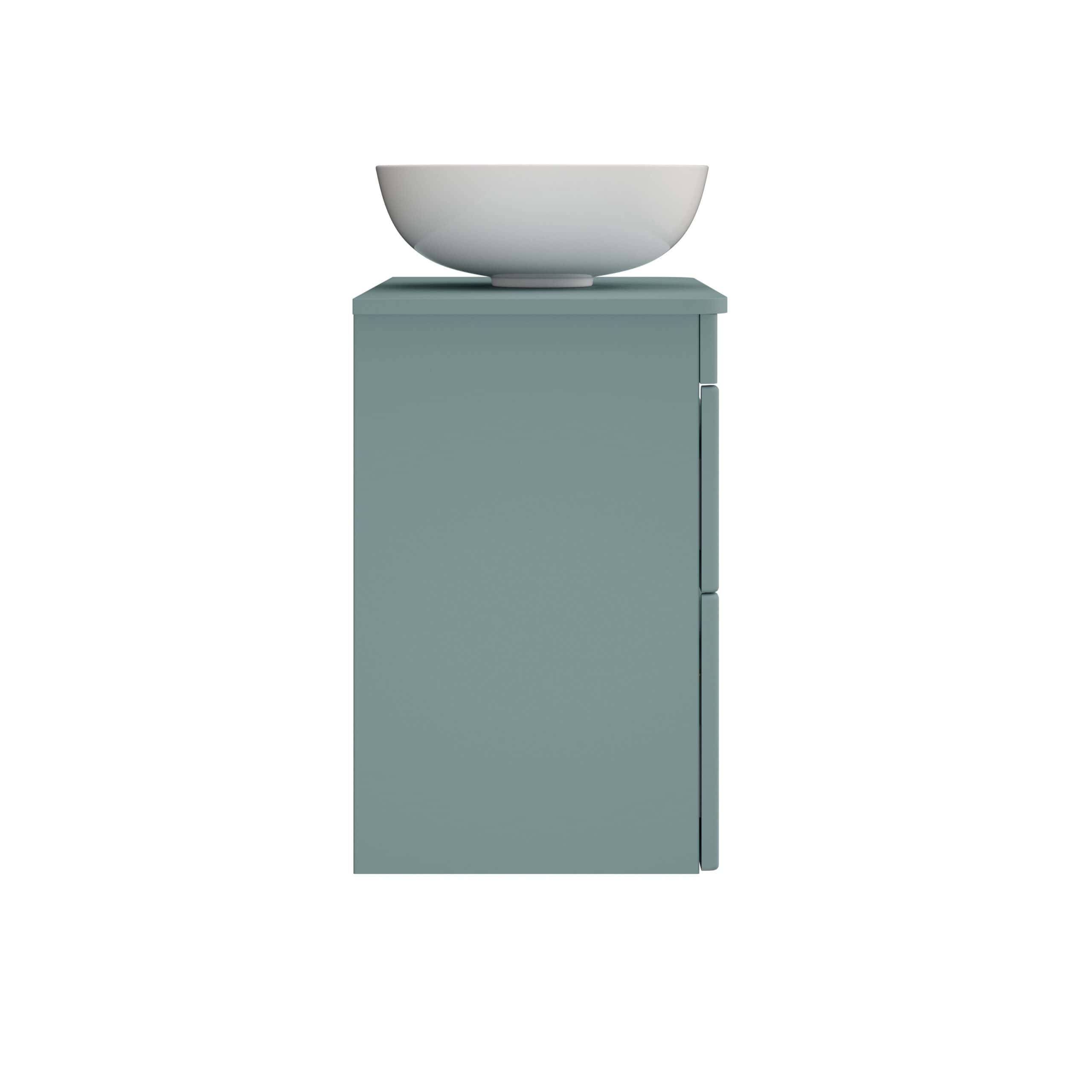 White ceramic bathroom basin on a modern blue vanity unit for an elegant bathroom design. Perfect for contemporary bathroom renovations and stylish fixtures.