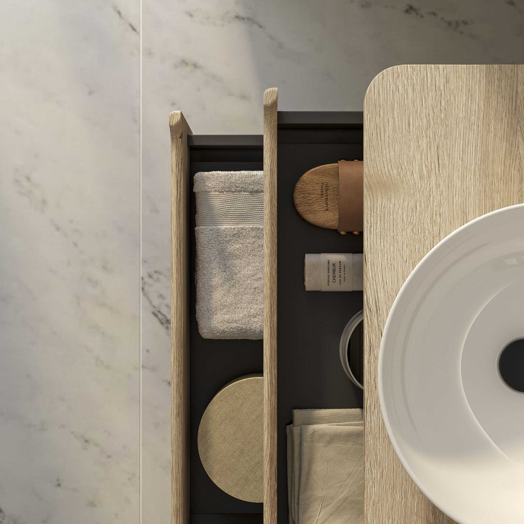 Luxurious bathroom storage with towels, soap, and accessories on a sleek, modern wooden shelf in a contemporary bathroom.