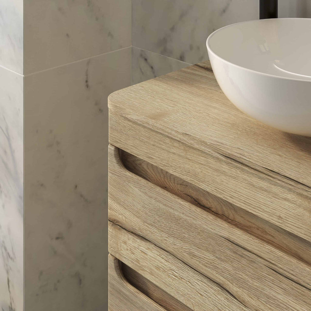 Sleek wooden bathroom vanity with a round white vessel sink, modern bathroom design, natural wood finish, marble wall tile, minimalist bathroom vanity unit, elegant bathroom furniture.