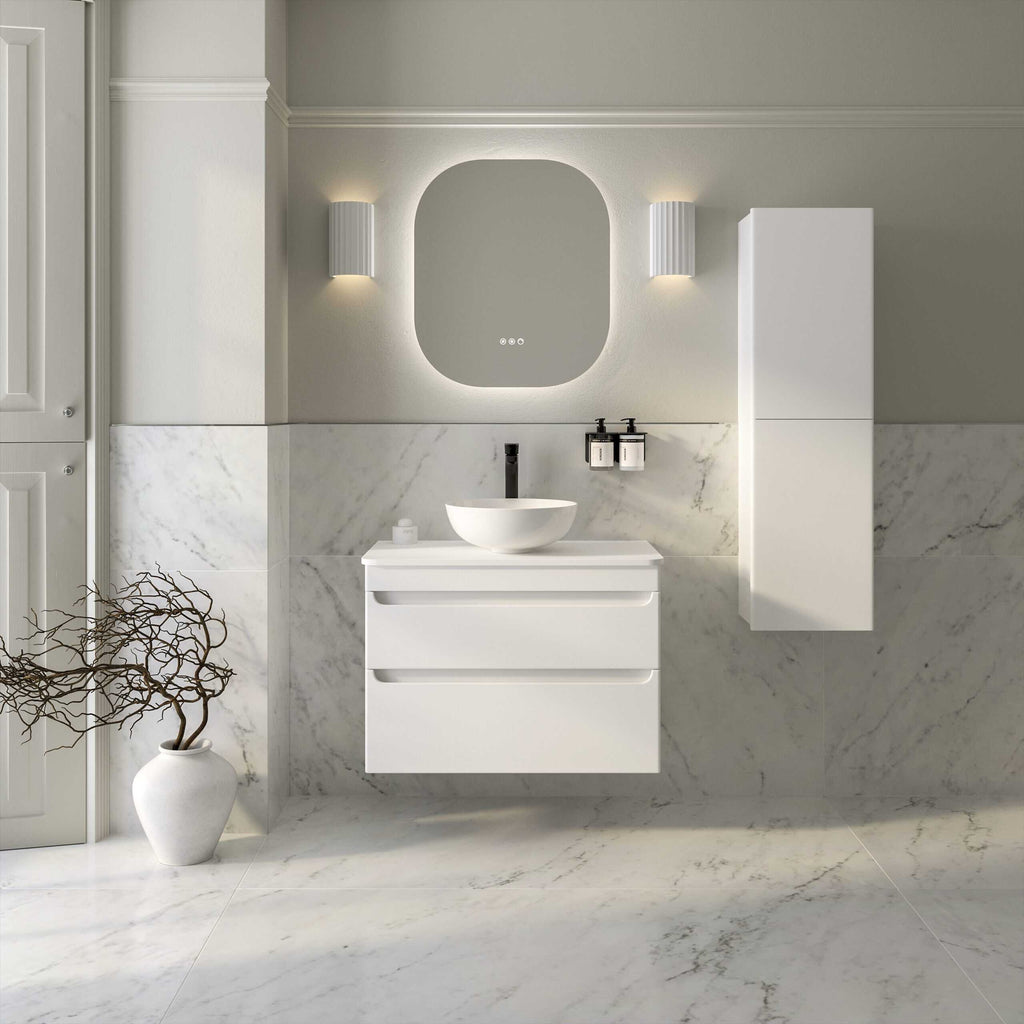 Modern white bathroom vanity with basin and sleek mirror, featuring contemporary lighting and marble tiles for a stylish, minimalistic bathroom design.