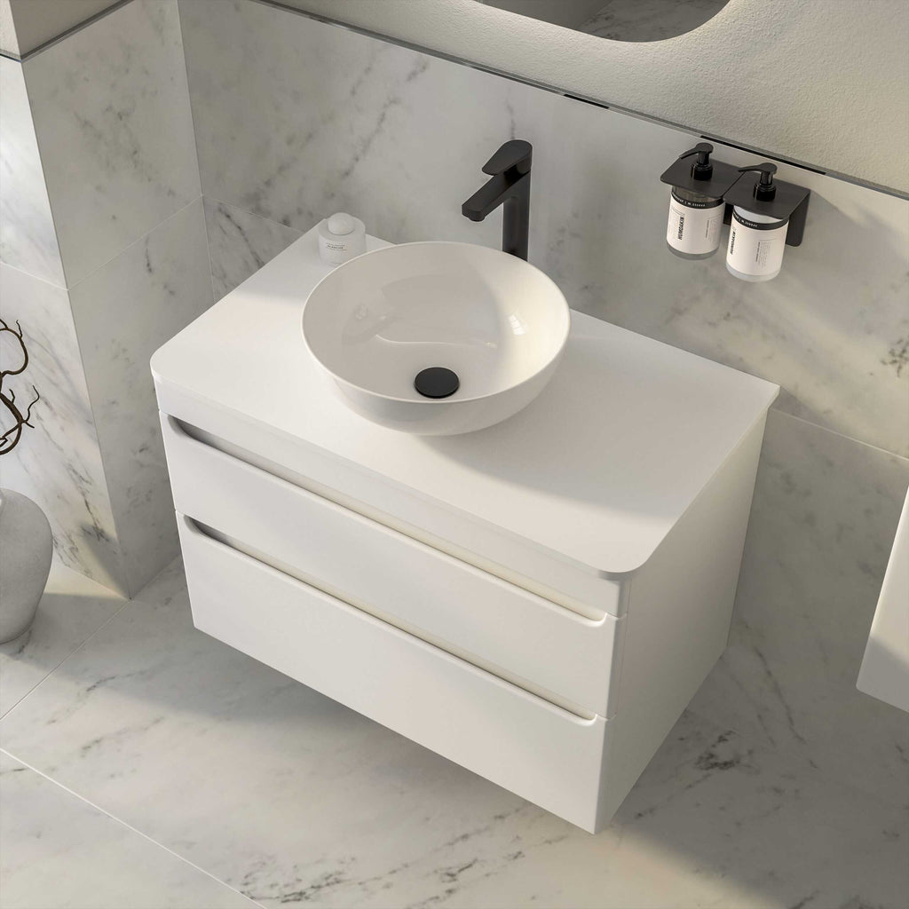 Modern white bathroom vanity with a stylish vessel sink and matte black fixtures, perfect for contemporary bathroom designs and improving bathroom aesthetics.
