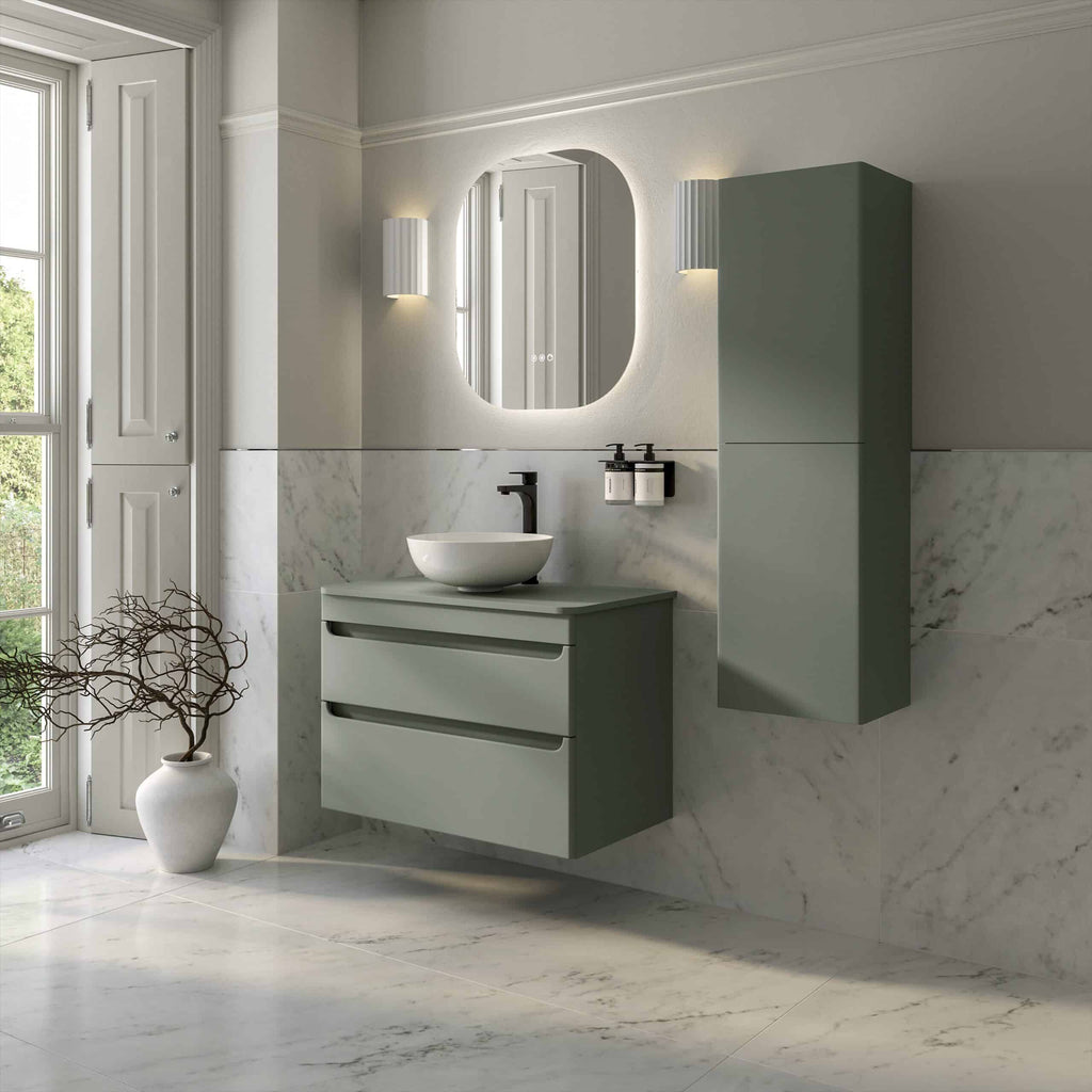 Sleek modern bathroom vanity set with sage green drawers and wall cabinet, white vessel sink, black faucet, and minimalist accessories, creating a stylish and functional bathroom space for contemporary bathroom design.