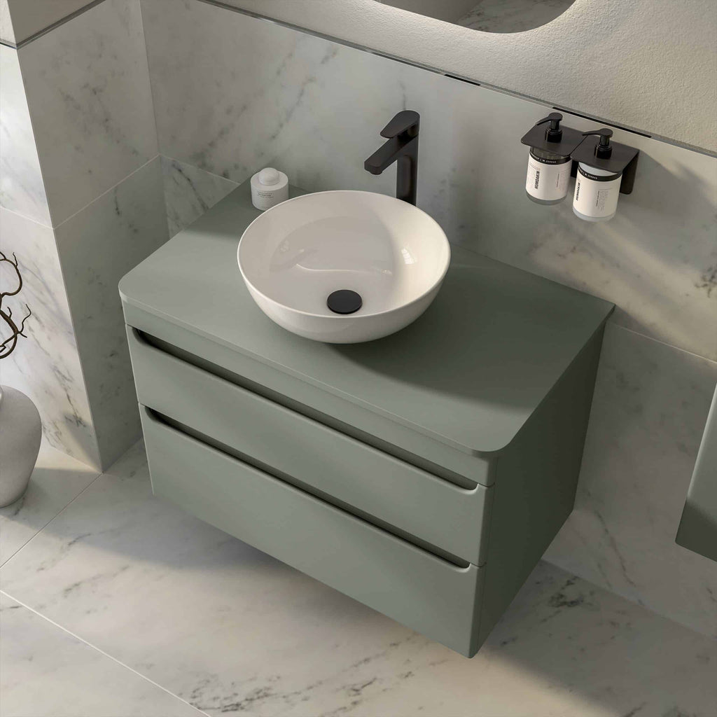 Modern grey bathroom vanity with a white vessel sink and black fixtures, featuring sleek drawers and wall-mounted soap dispensers for contemporary bathroom design.