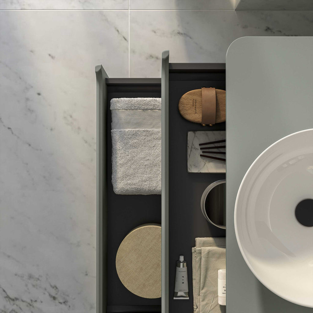 Elegant grey bathroom storage drawer with towels, marble accessories, and toiletries, showcasing modern and minimalistic bathroom organisation ideas.