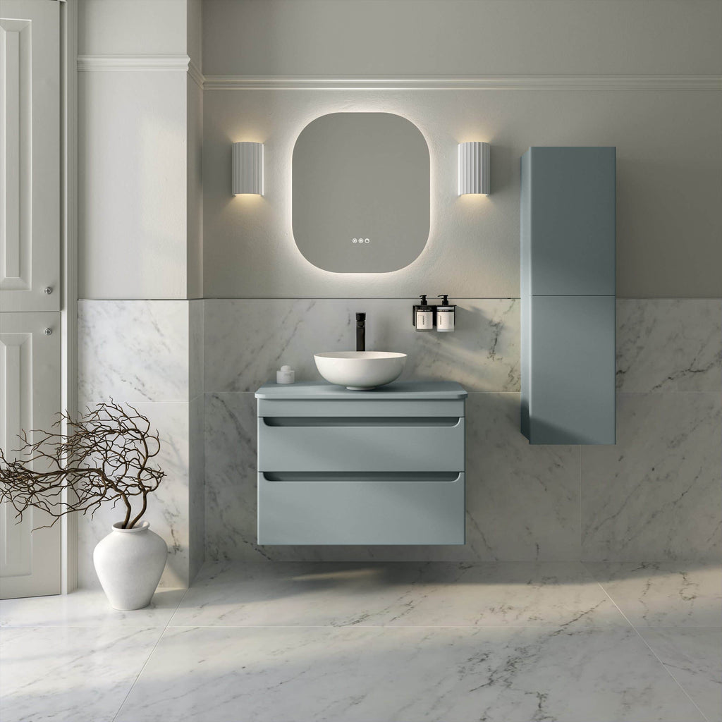 Sleek modern bathroom with minimalistic blue vanity, wall-mounted mirror, marble tiles, and contemporary lighting, designed for stylish and functional Bubly Bathrooms.