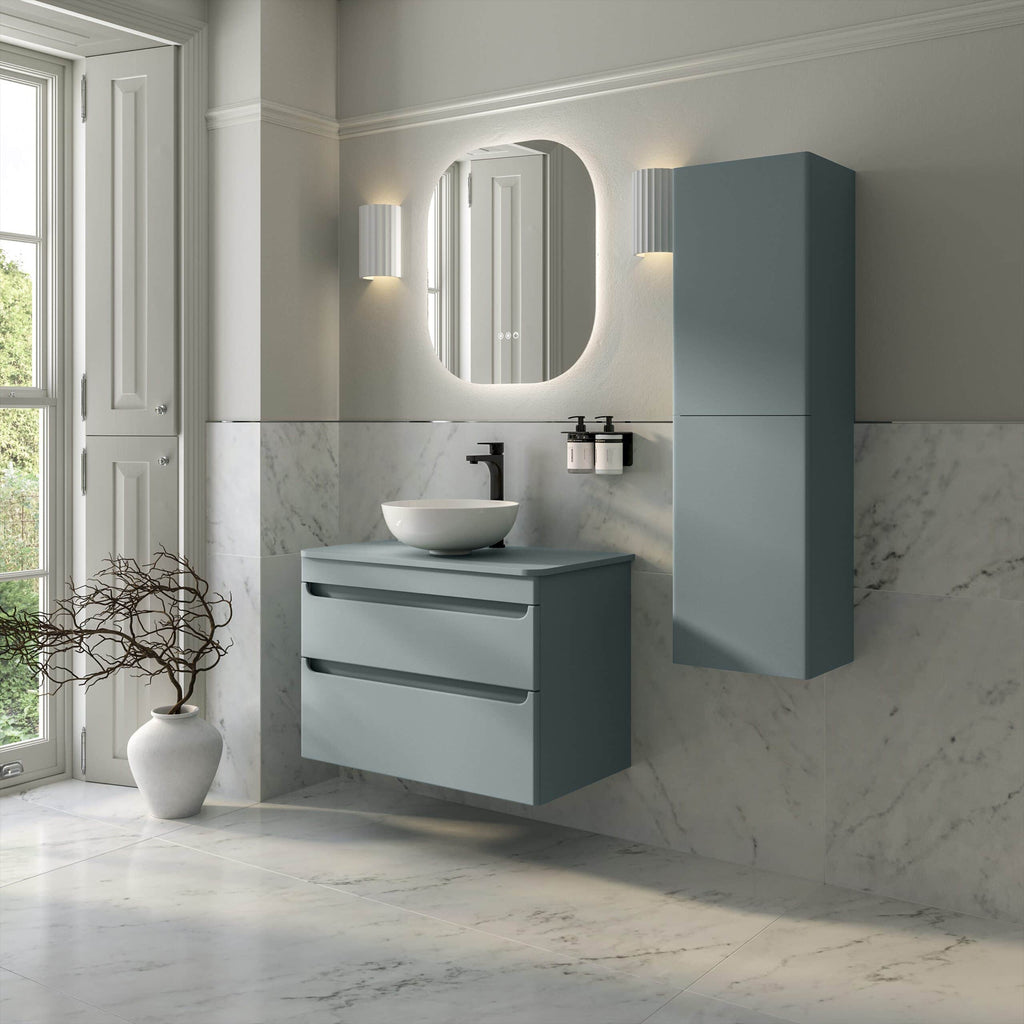 Modern blue bathroom vanity with vessel sink, wall-mounted cabinet, and illuminated mirror in contemporary bathroom design.