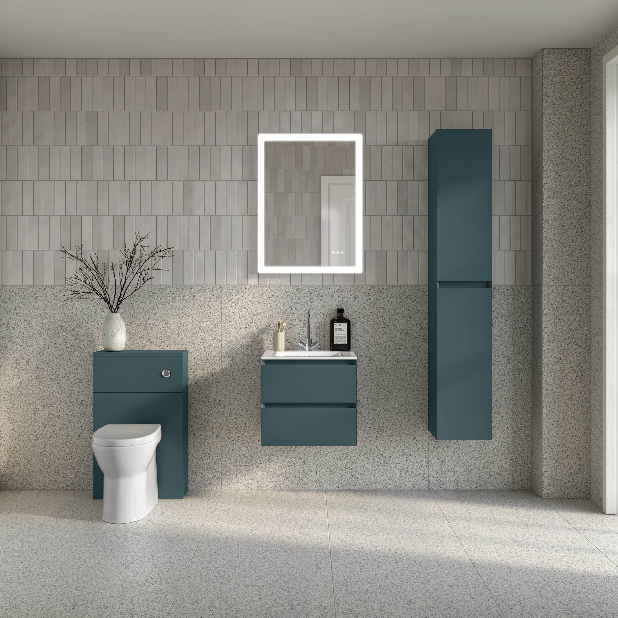 Contemporary bathroom with blue cabinetry, wall-mounted mirror with LED lighting, and modern fixtures, showcasing stylish bathroom design and storage solutions for a sleek aesthetic.