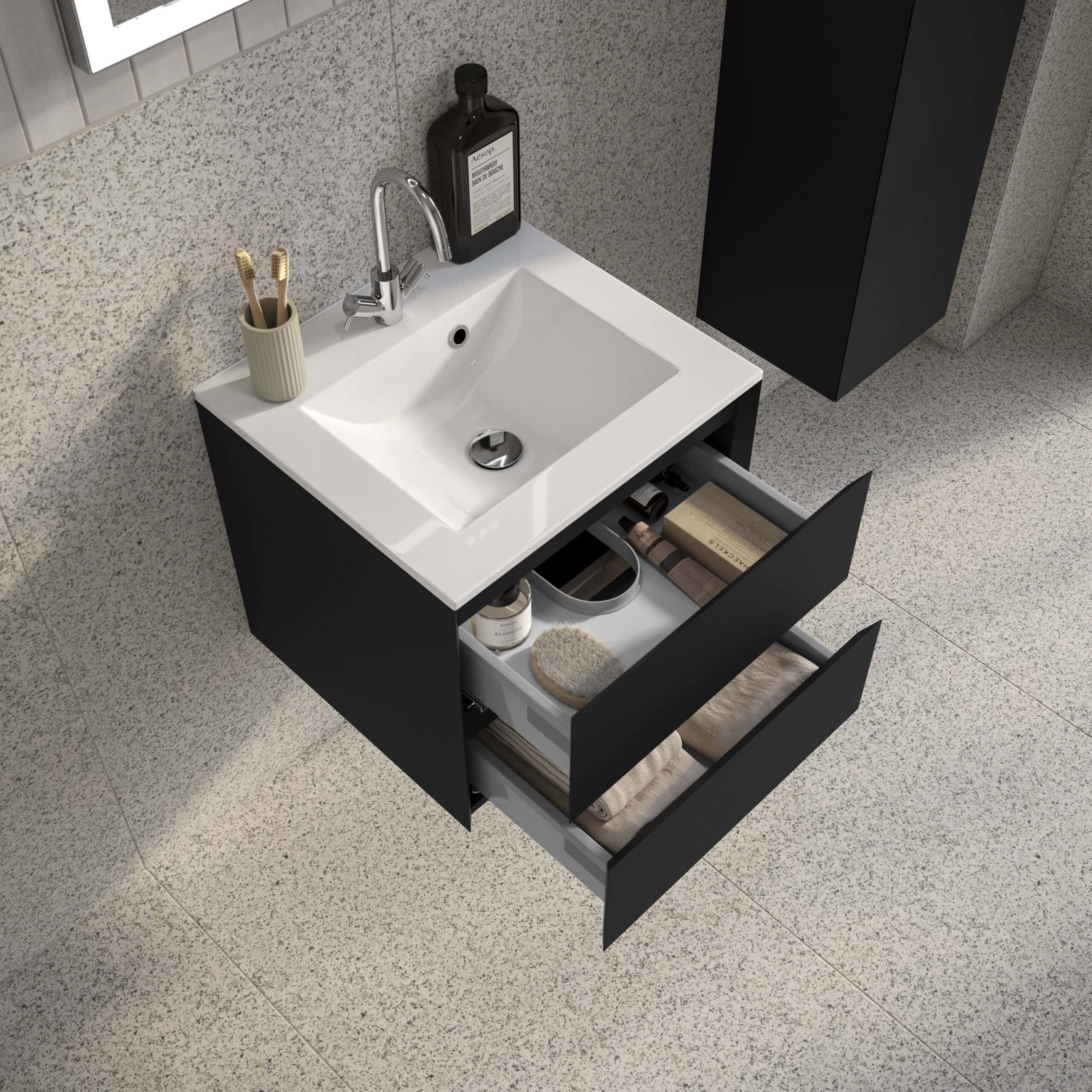 Sleek black bathroom vanity with white ceramic sink, open drawers displaying towels, toiletries, and grooming essentials, modern design, perfect for contemporary bathroom interiors.