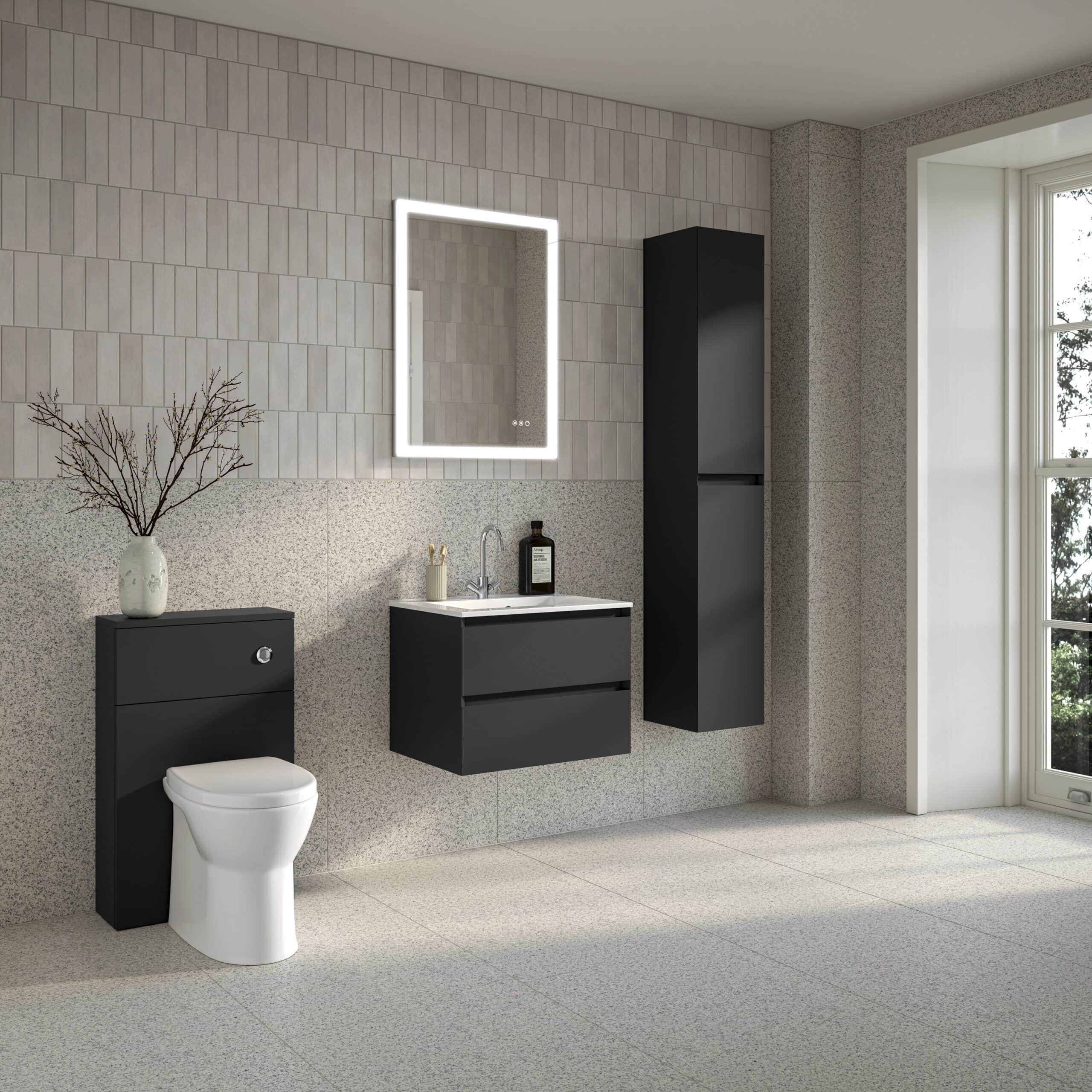 Modern minimalist black and white bathroom with wall-mounted vanity, tall storage cabinet, illuminated mirror, and contemporary toilet, featuring sleek design and functional storage solutions.