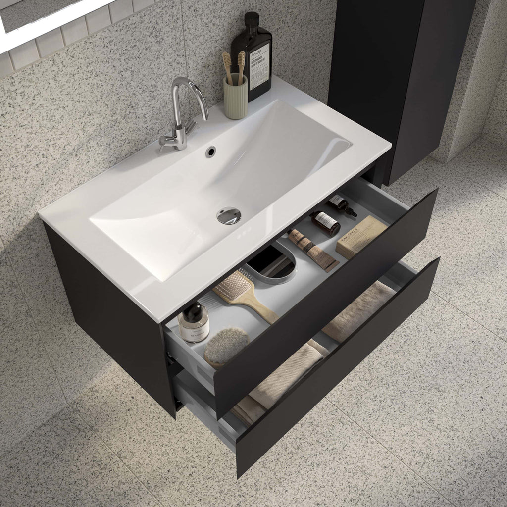 Sleek modern bathroom vanity with a white ceramic sink and open storage drawers, featuring bathroom essentials and accessories in a contemporary bathroom setting.