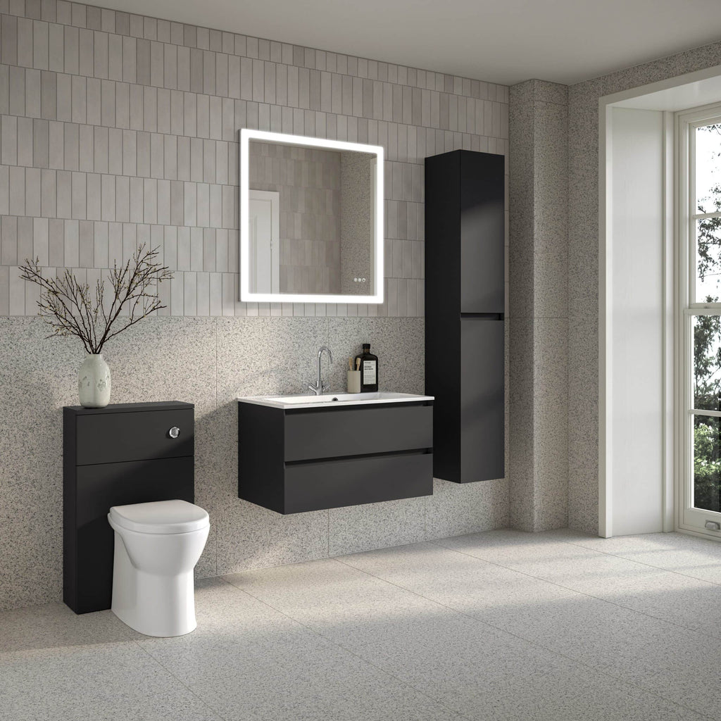 Sleek modern black bathroom vanity with a white countertop and integrated sink, complemented by a tall black storage cabinet, set against a textured grey tiled wall in a contemporary bathroom.