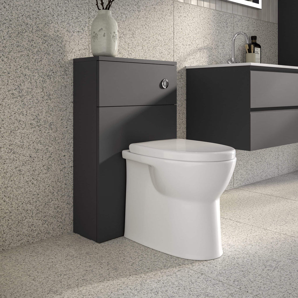 Modern white toilet with sleek black bathroom cabinets and granite wall detail for contemporary bathroom design.