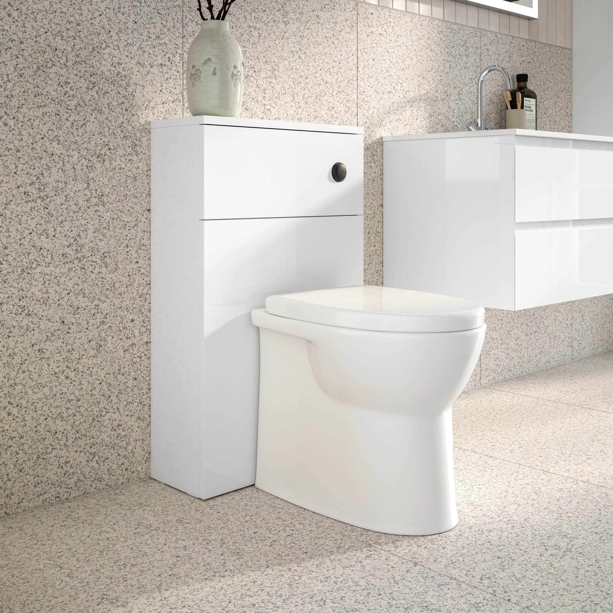 Modern white toilet with minimalist storage cabinet in contemporary bathroom setting.