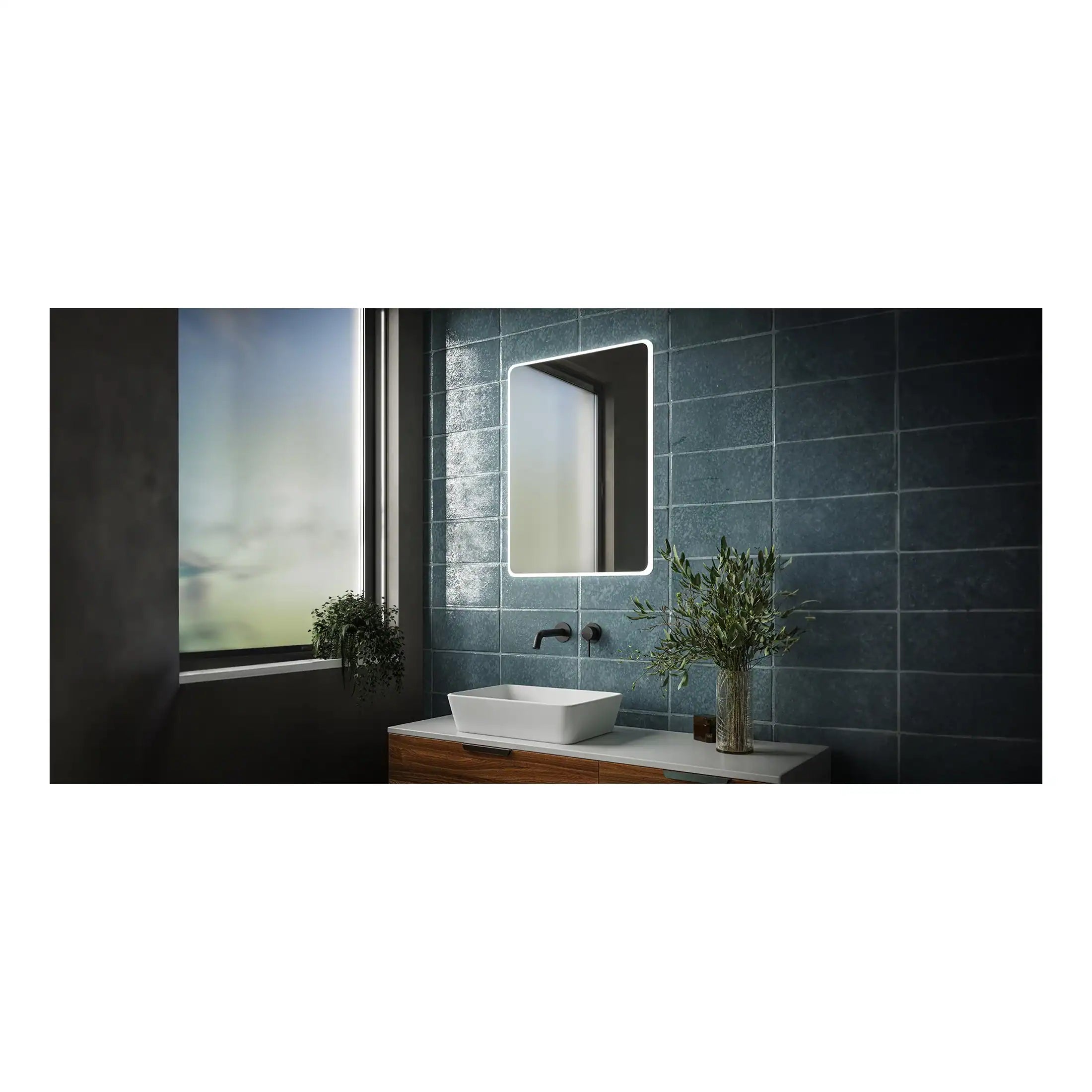 Sleek modern bathroom vanity with a vessel sink, illuminated mirror, blue tiles, and decorative plants creating a stylish and contemporary look.