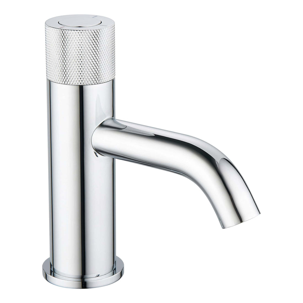 Sleek modern chrome bathroom tap with a cylindrical design and textured top, perfect for contemporary bathroom interiors.