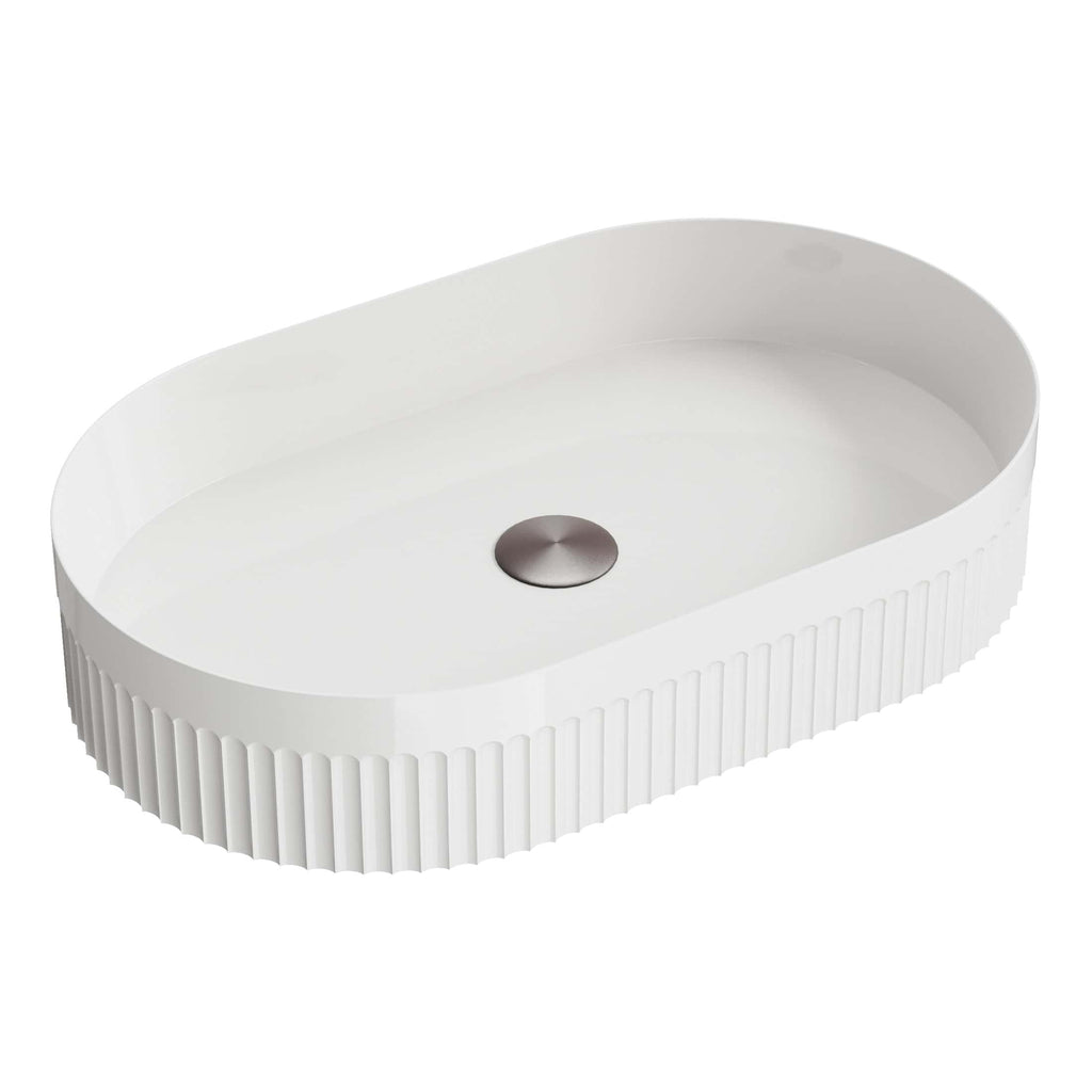 Sleek white oval bathroom sink with ribbed sides and central drain, ideal for modern bathroom decor and ample counter space. Perfect for contemporary bathroom designs.