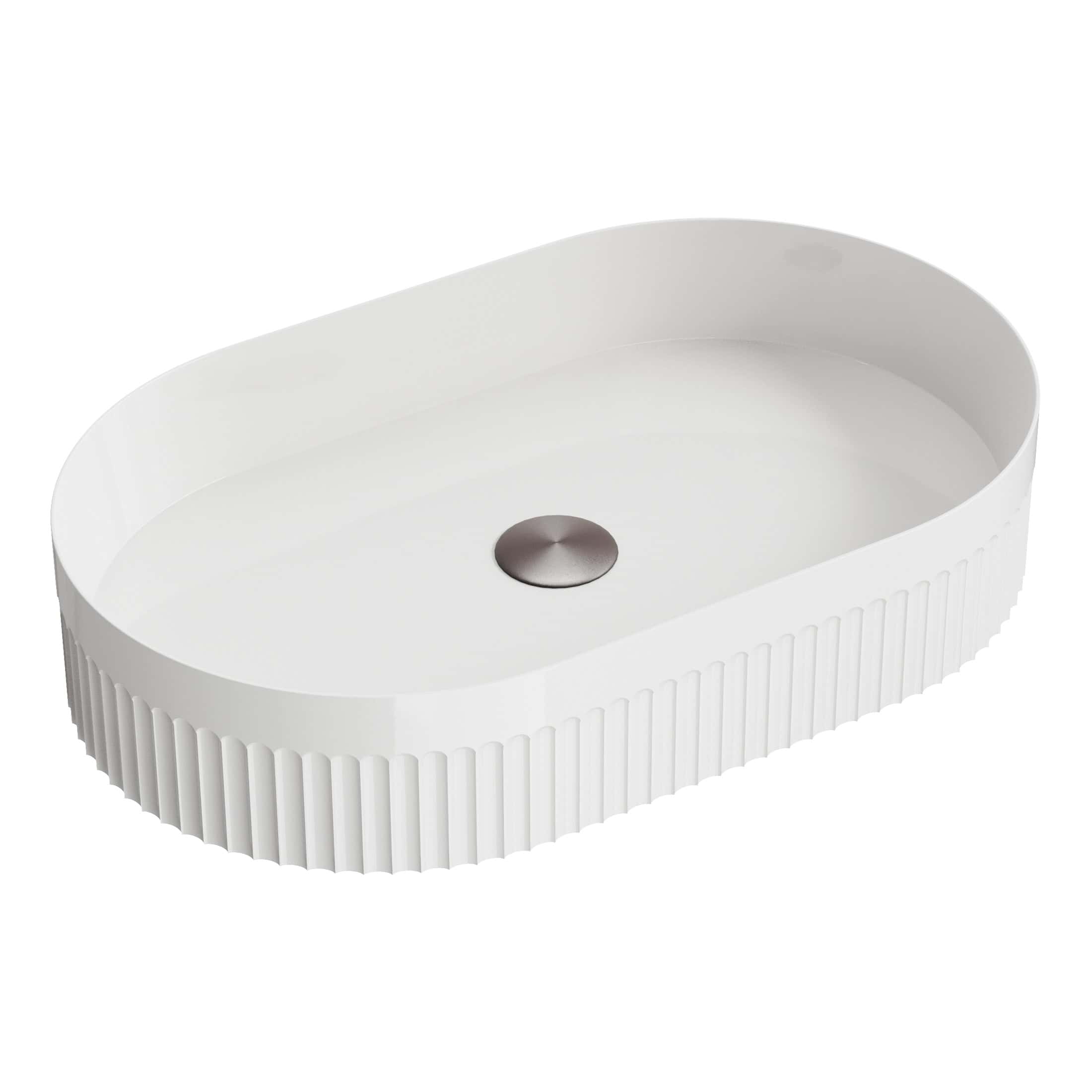 Sleek white oval bathroom sink with ribbed sides and central drain, ideal for modern bathroom decor and ample counter space. Perfect for contemporary bathroom designs.