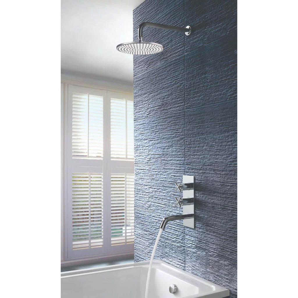 Modern bathroom shower with sleek chrome fixtures, textured navy wall tiles, and natural light from white plantation shutters.