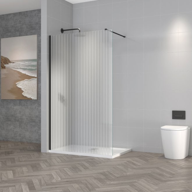 Modern walk-in shower with frosted glass screening, grey tiled walls, and minimalist white toilet in contemporary bathroom design. Perfect for sleek and functional bathroom renovations or upgrades.