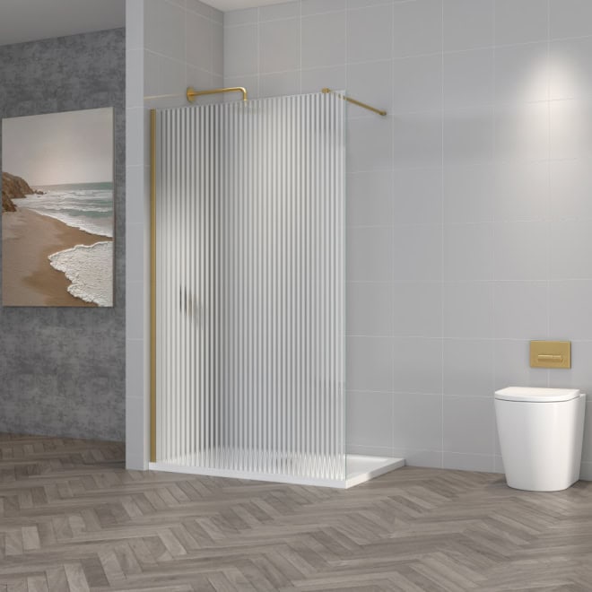 Modern shower enclosure with frosted glass panel and gold fixtures in a contemporary bathroom with grey tiled walls and toilet, perfect for stylish bathroom renovations.